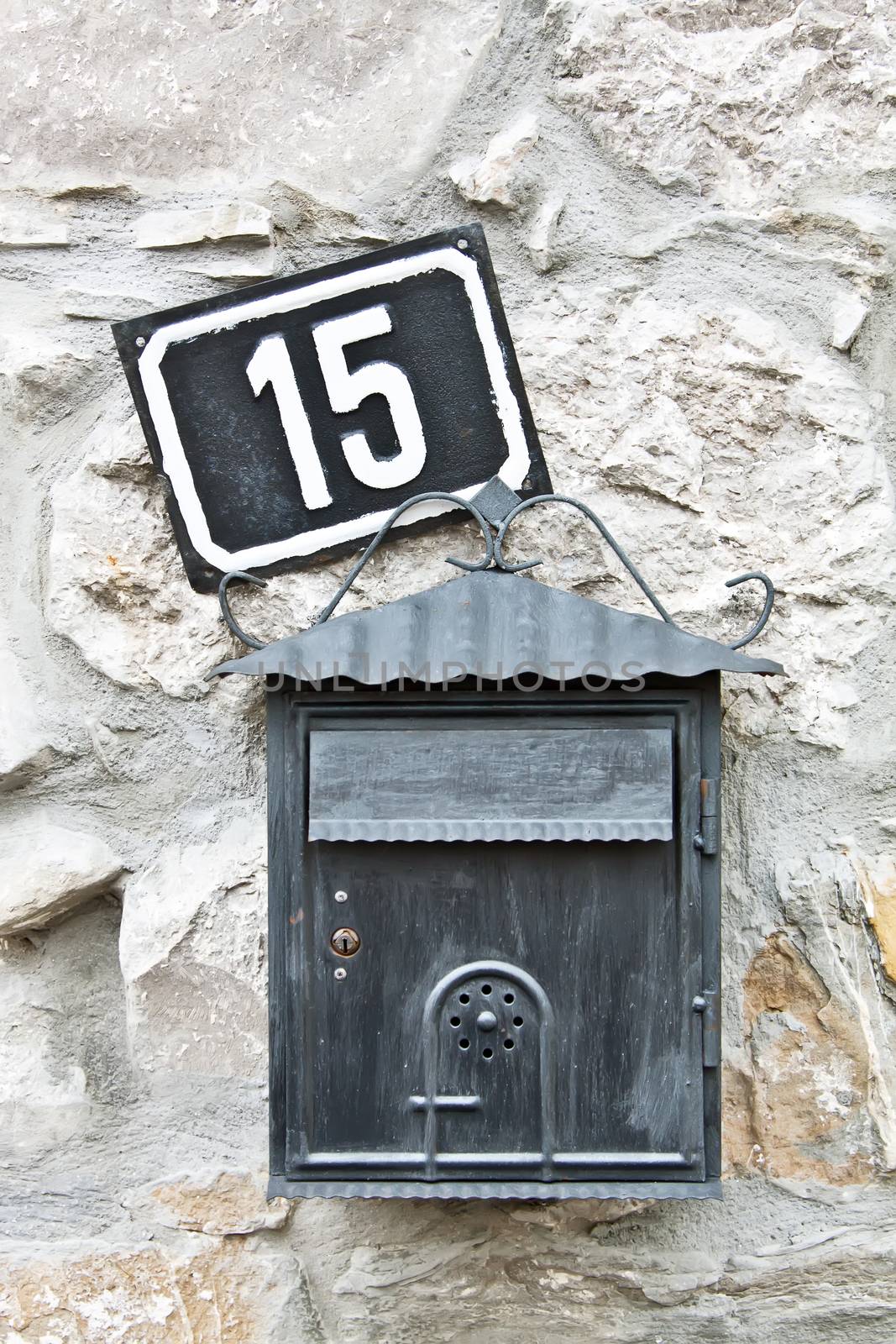 mail box and house number on the wall