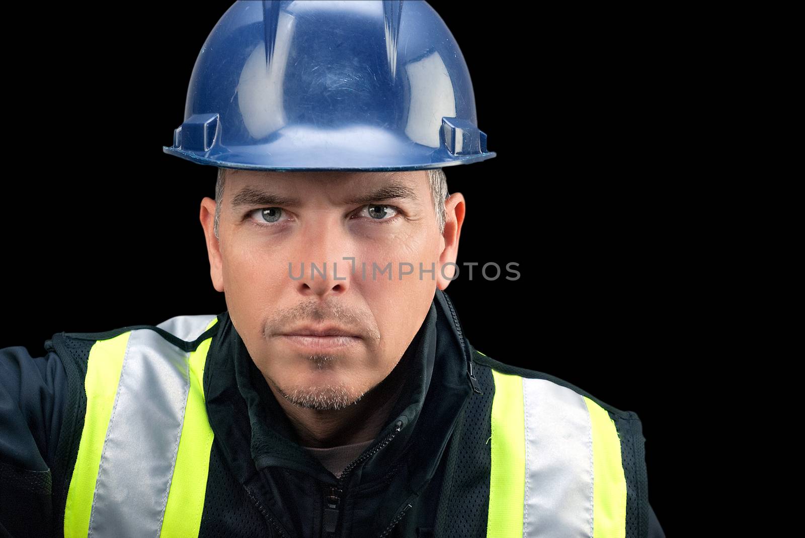 Close-up of a construction worker looking to camera.