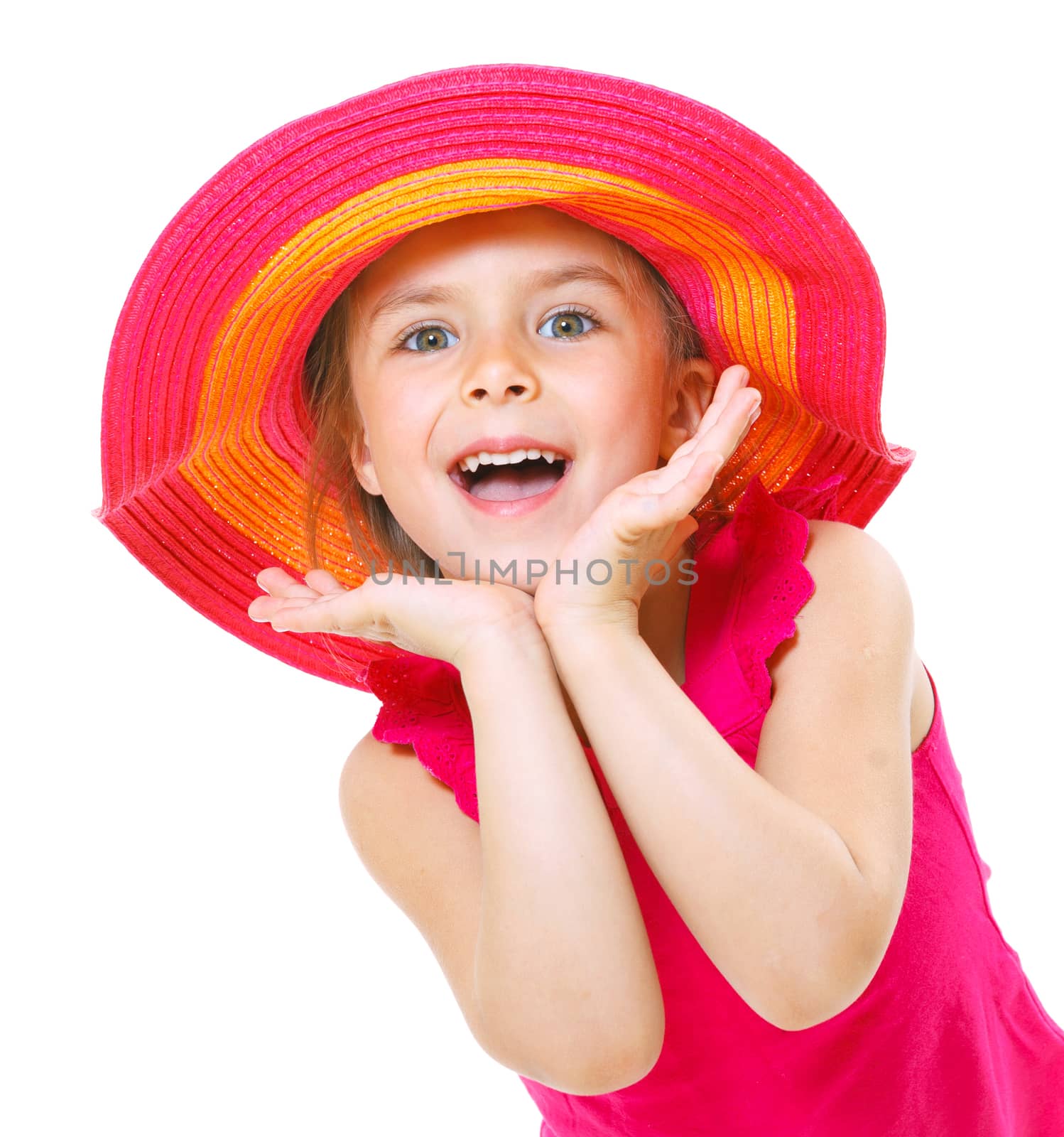 Cute little girl wearing a beach hat smiling isolated on a white background.