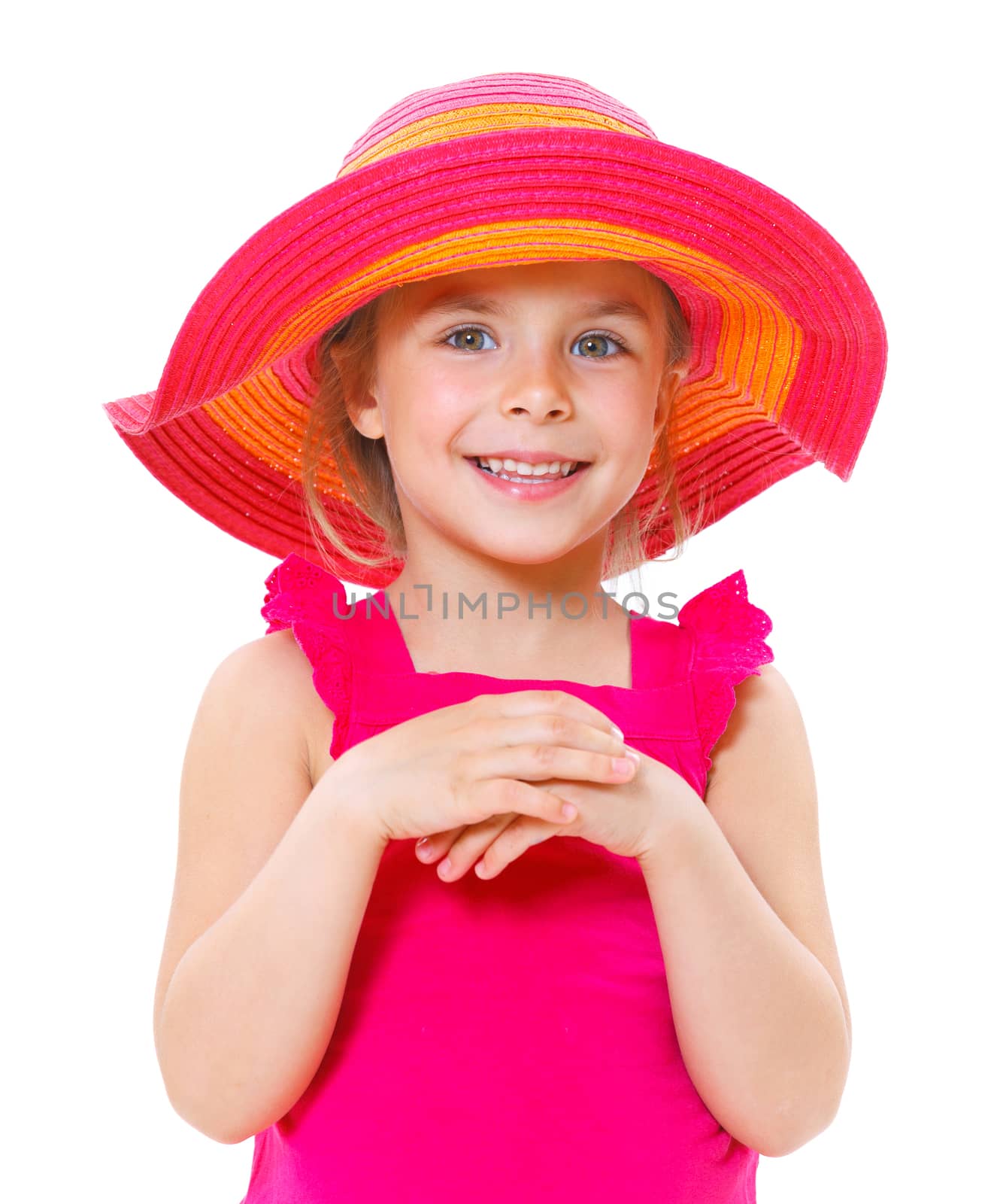 Cute little girl wearing a beach hat smiling isolated on a white background.