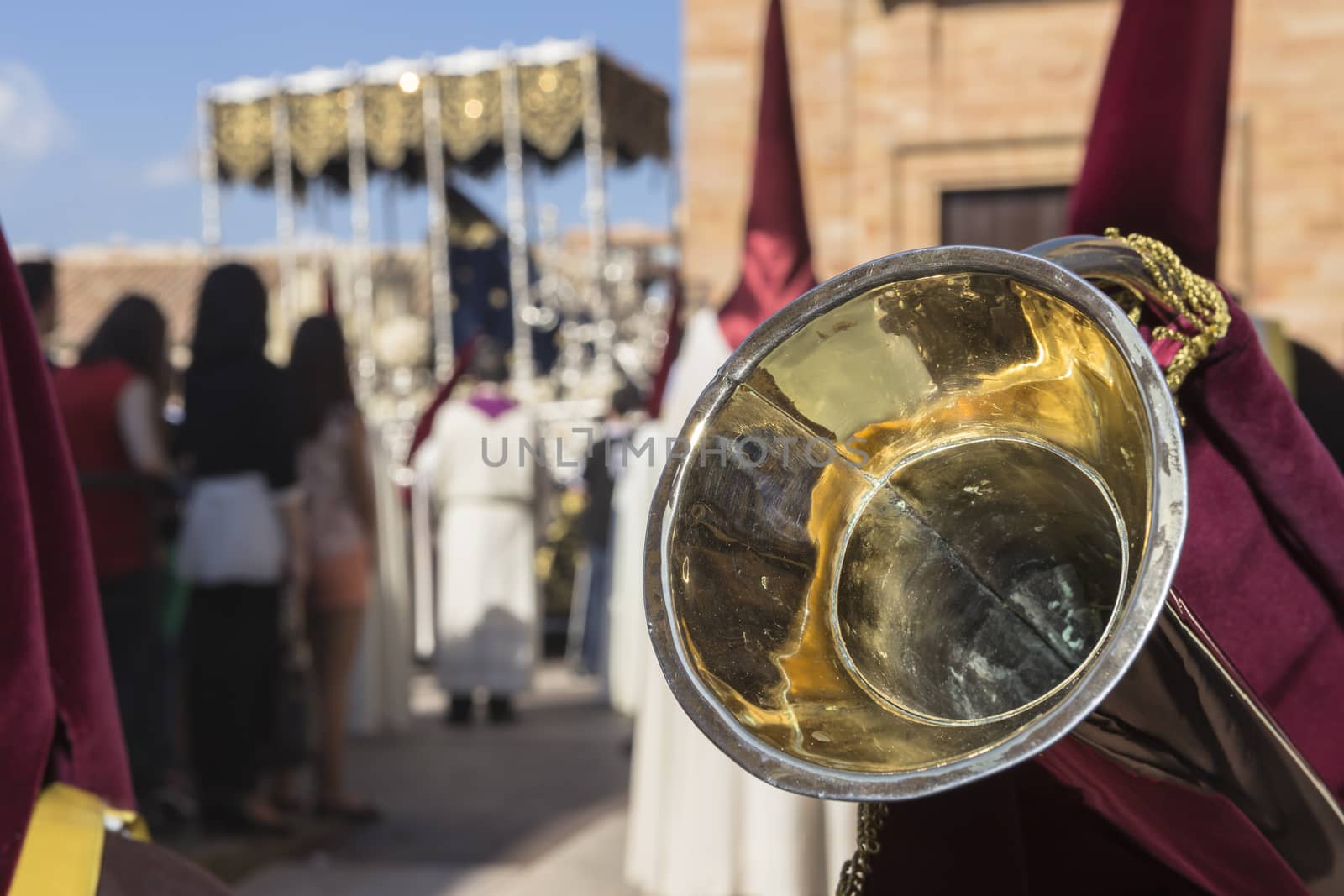 Linares, Jaen province, SPAIN - March 17, 2014: Nuestra Señora de los Dolores going out of the church of Santa Maria, detail of typical elongated trumpet of this brotherhood, taken in Linares, Jaen province, Andalusia, Spain