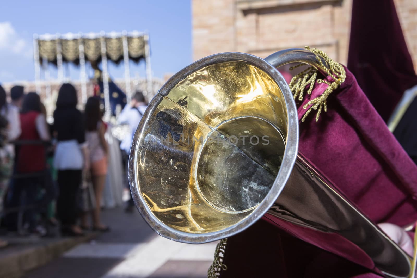 Linares, Jaen province, SPAIN - March 17, 2014: Nuestra Señora de los Dolores going out of the church of Santa Maria, detail of typical elongated trumpet of this brotherhood, taken in Linares, Jaen province, Andalusia, Spain