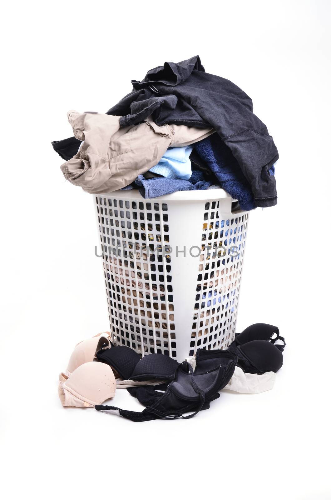 unwashed cloth in the basket on white background