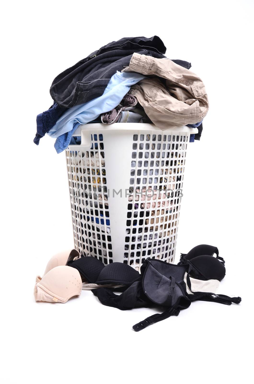 unwashed cloth in the basket on white background