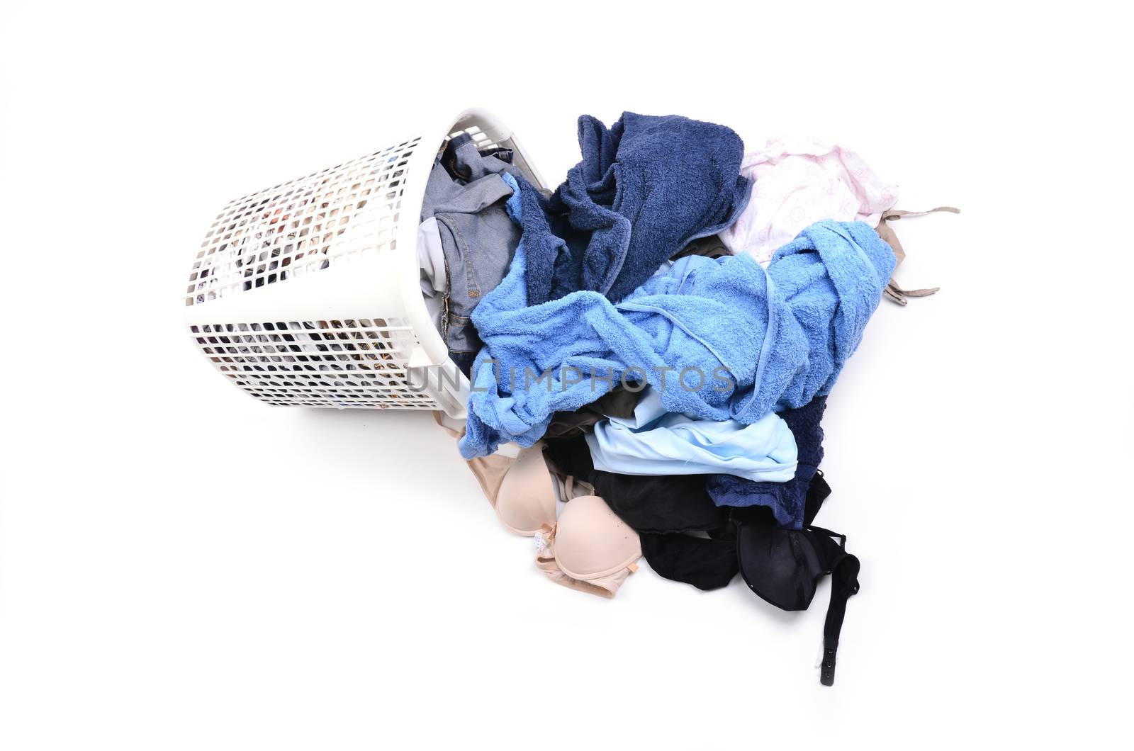 unwashed cloth in the basket on white background