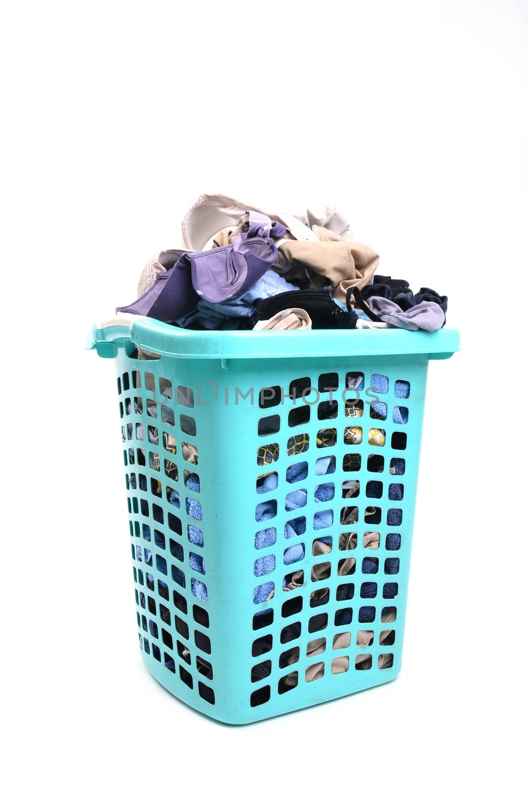 unwashed cloth in the basket on white background