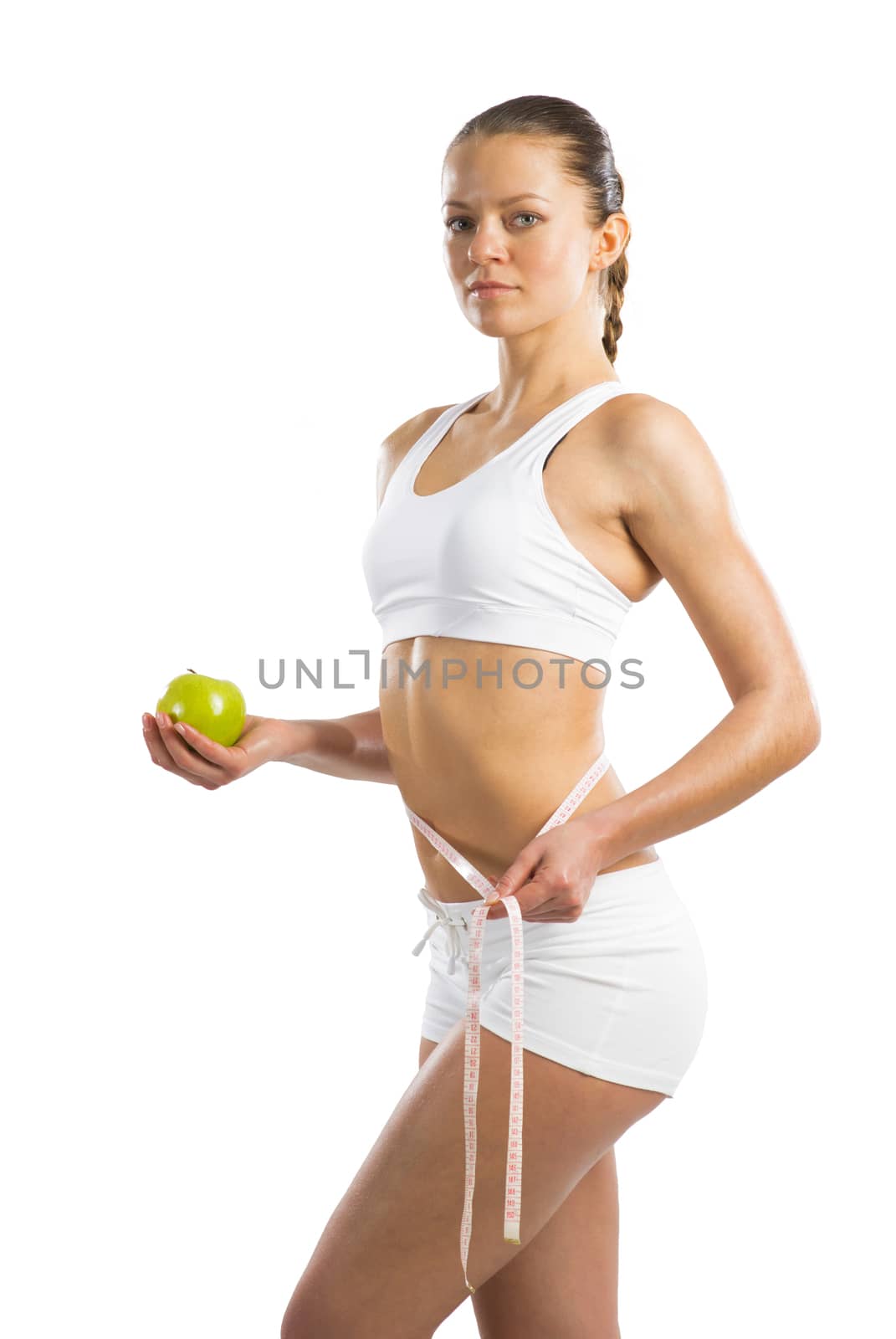 young athletic woman measuring waist by adam121