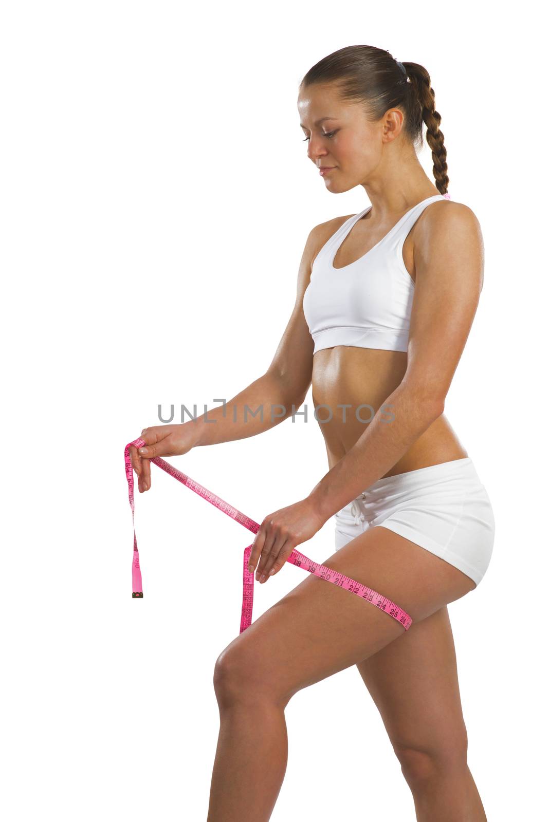 image of a young athletic woman measuring thigh