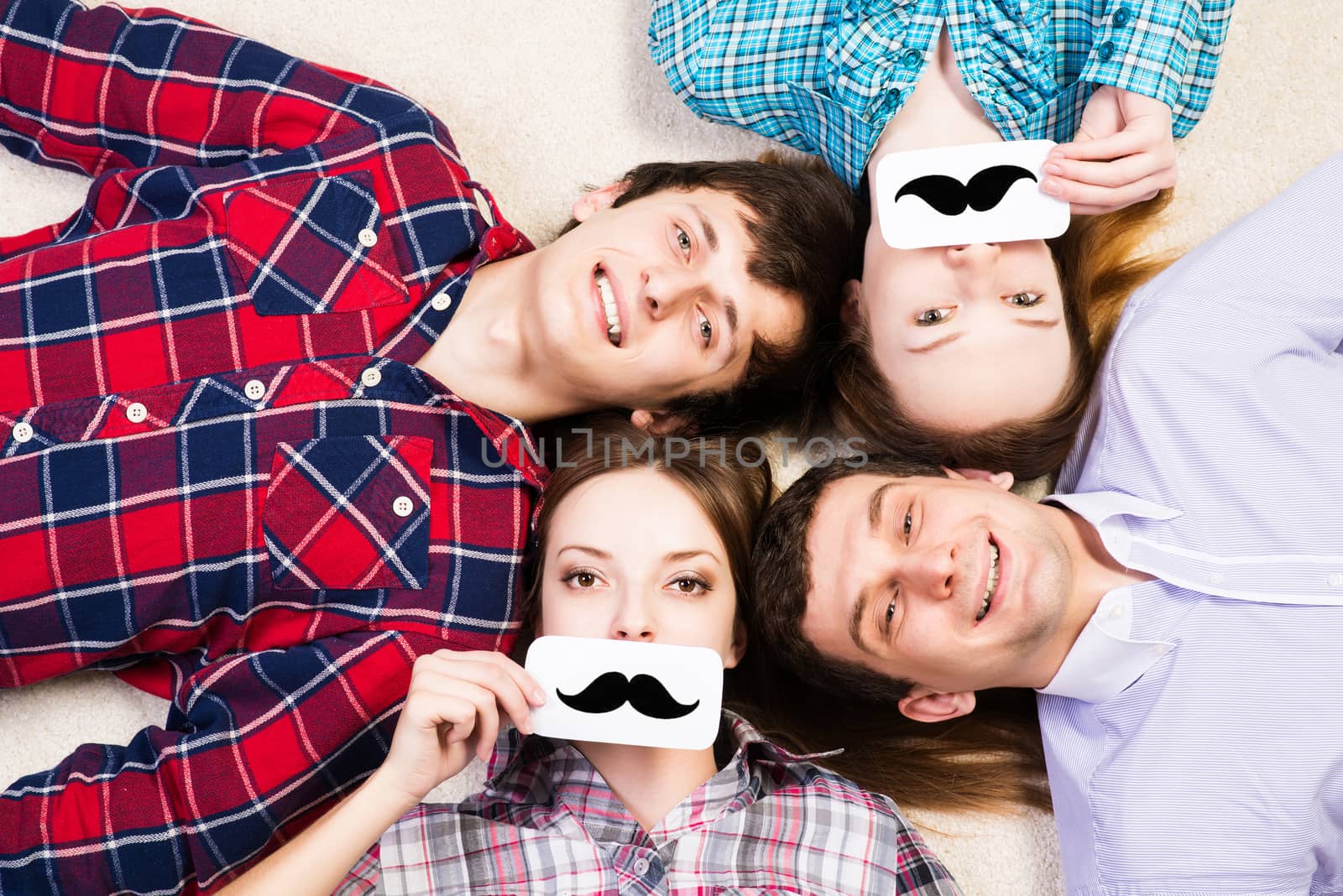 four young men lie together, applied to the face plate with a mustache