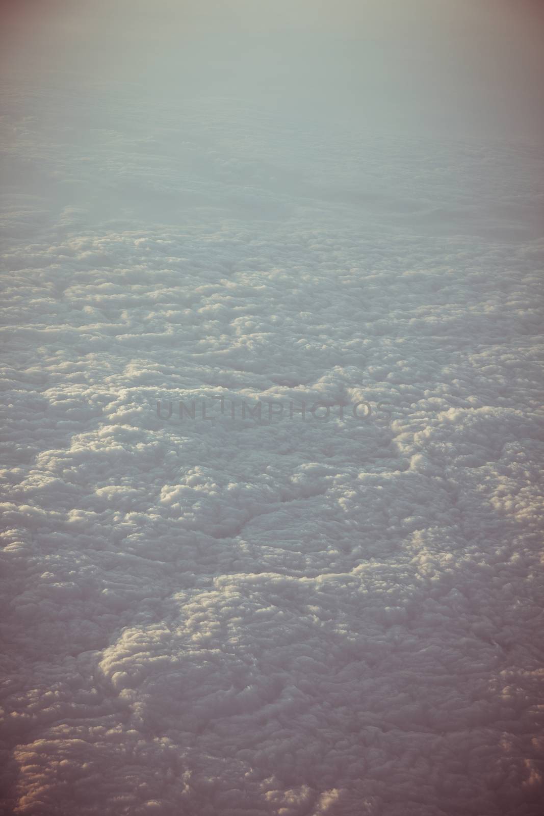 View through the aircraft window. Stratosphere cloudscape.