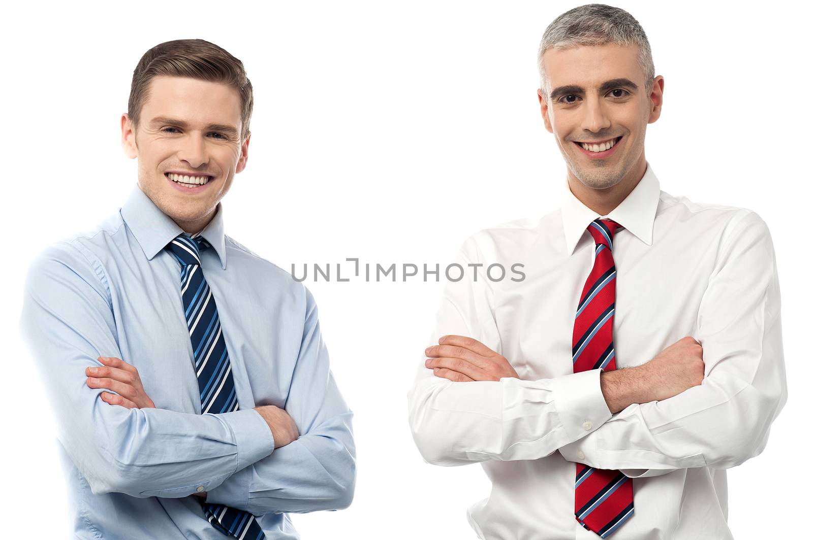 Happy businessman posing with arms folded