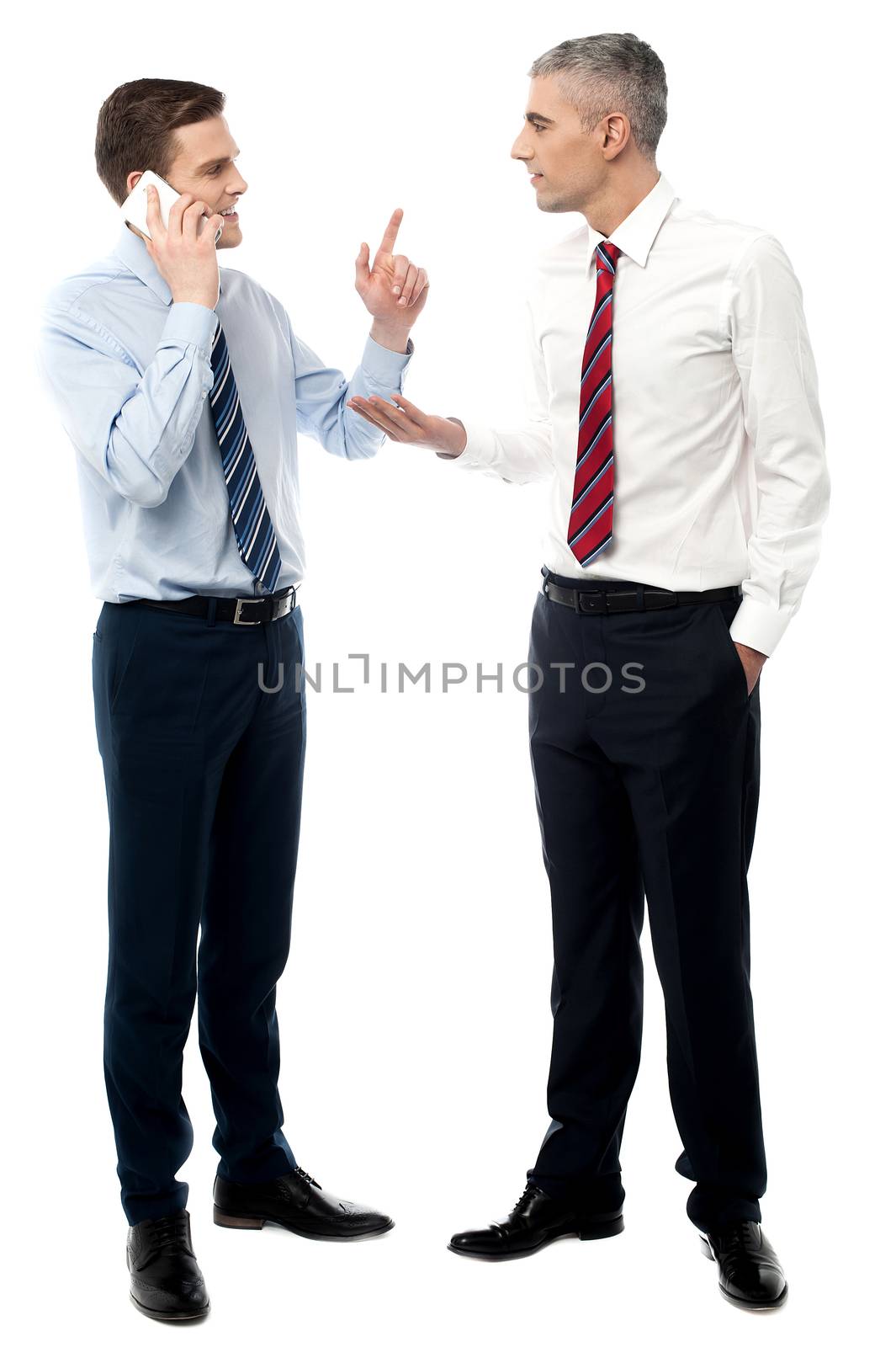 Business people discussing in office by stockyimages