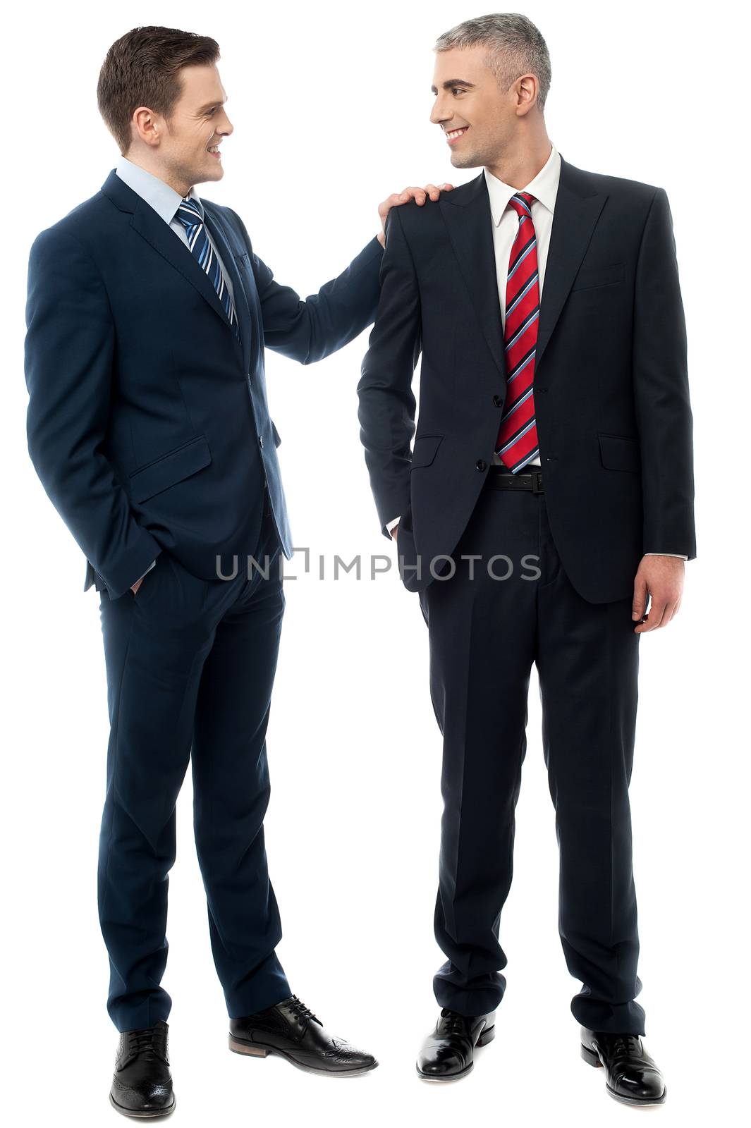 Two business men having conversation together 