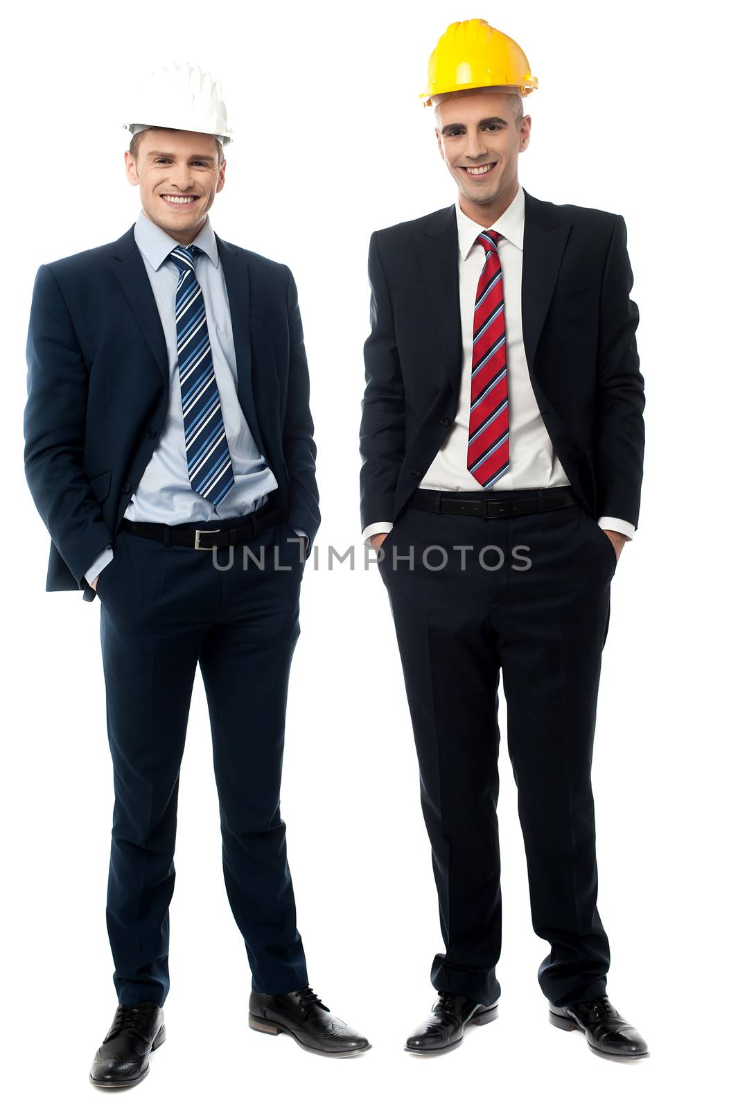 Businessmen posing with hard hat on white background