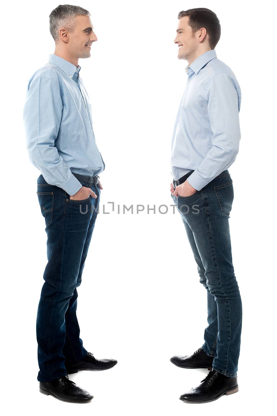Full length of two executives standing on white background