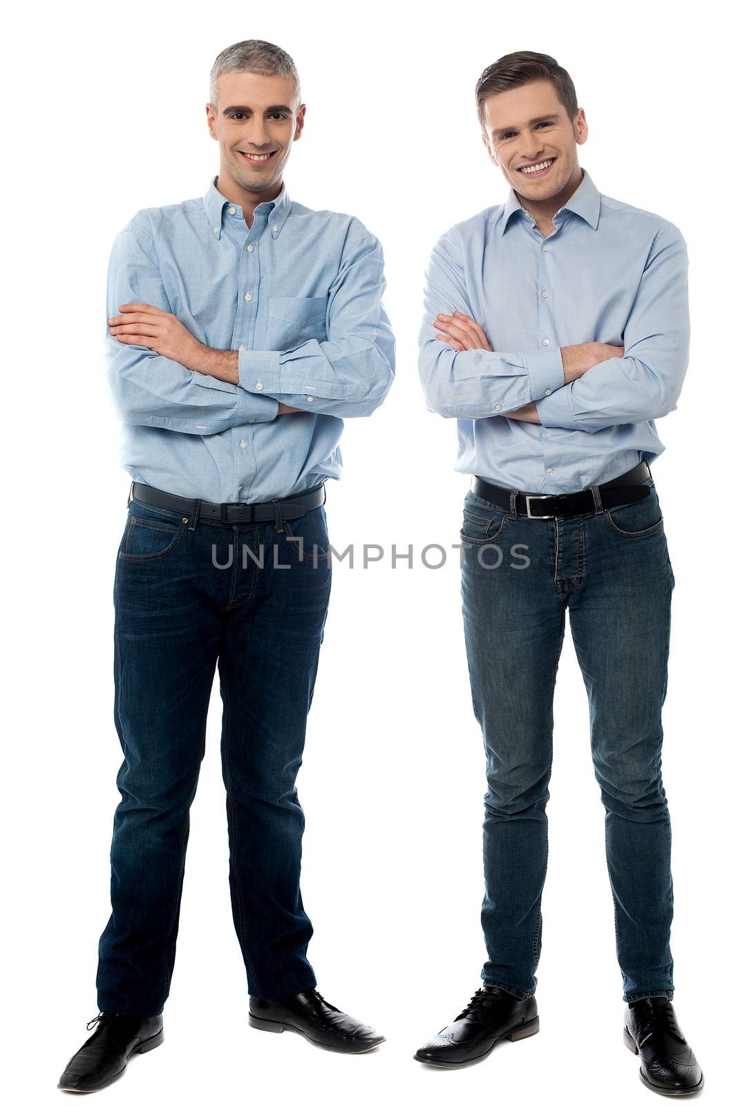 Casual young smiling men posing by stockyimages