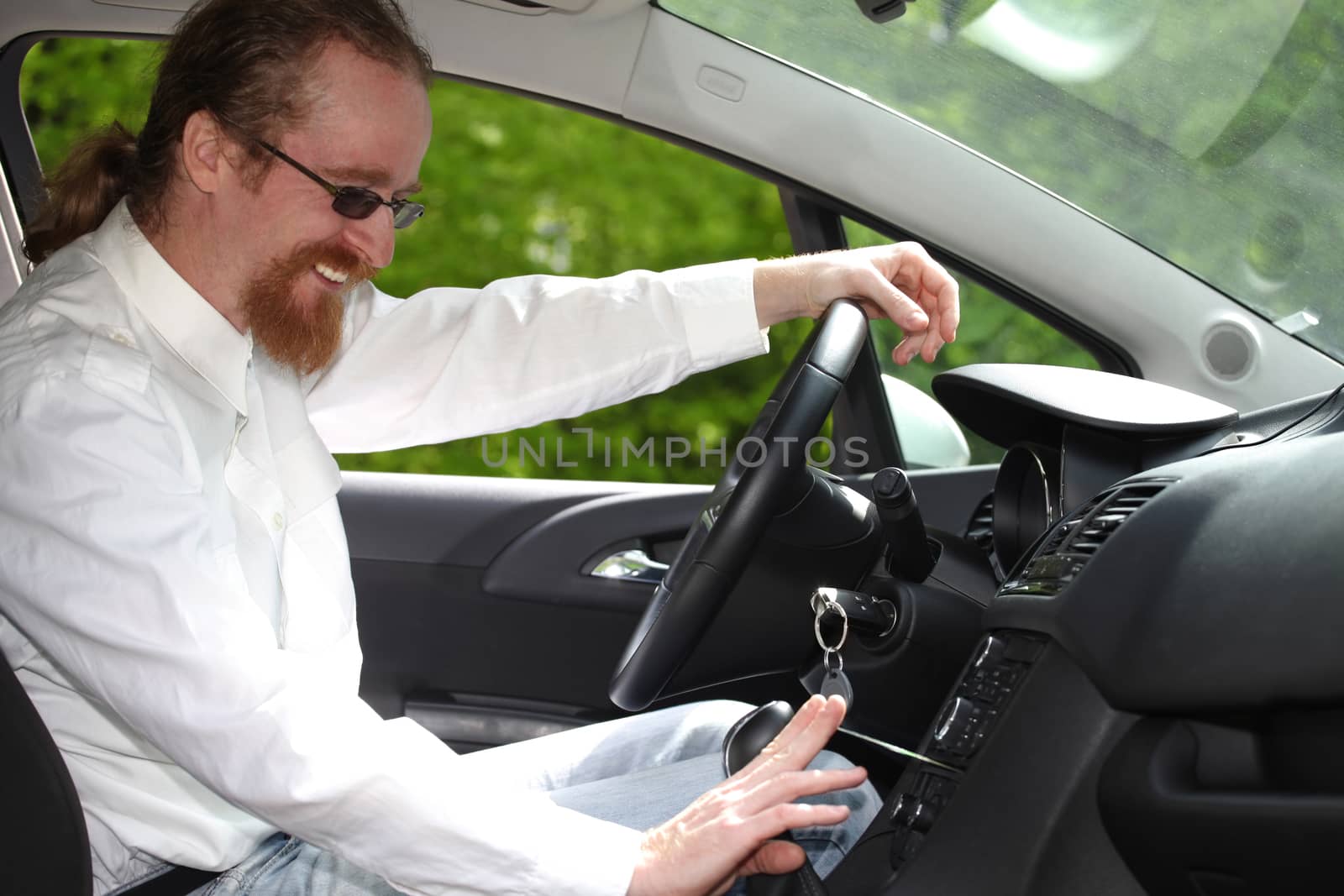 driver with CD, playing music in the car