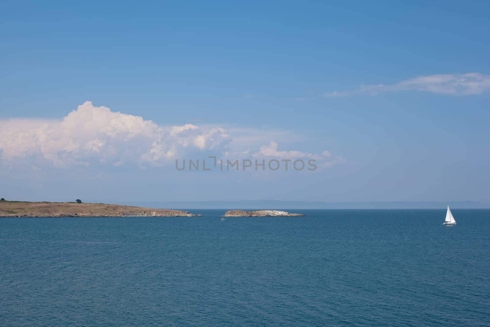 Island and boats above the sea in Sozopol in Bulgaria
