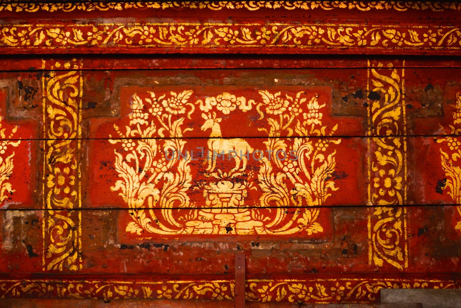 the detail of  thai gold painting pattern on ancient  wood plate,shallow focus,Lampang temple,Thailand