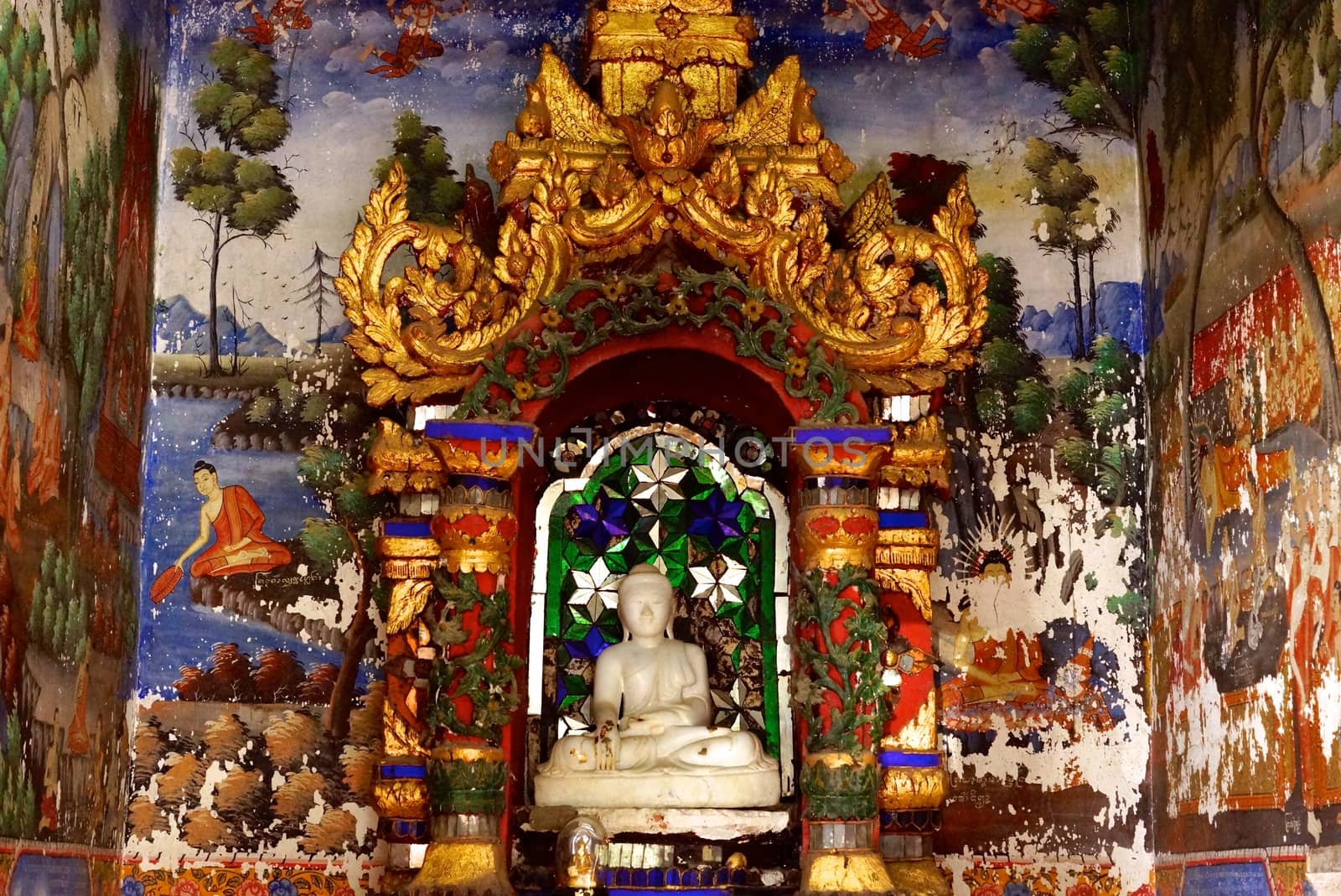 the detail of ancient thai decorated pattern that include handcraft wood carving work,gold painting and decorated with gold plate,mirror and precious stone,Lampang temple,Thailand