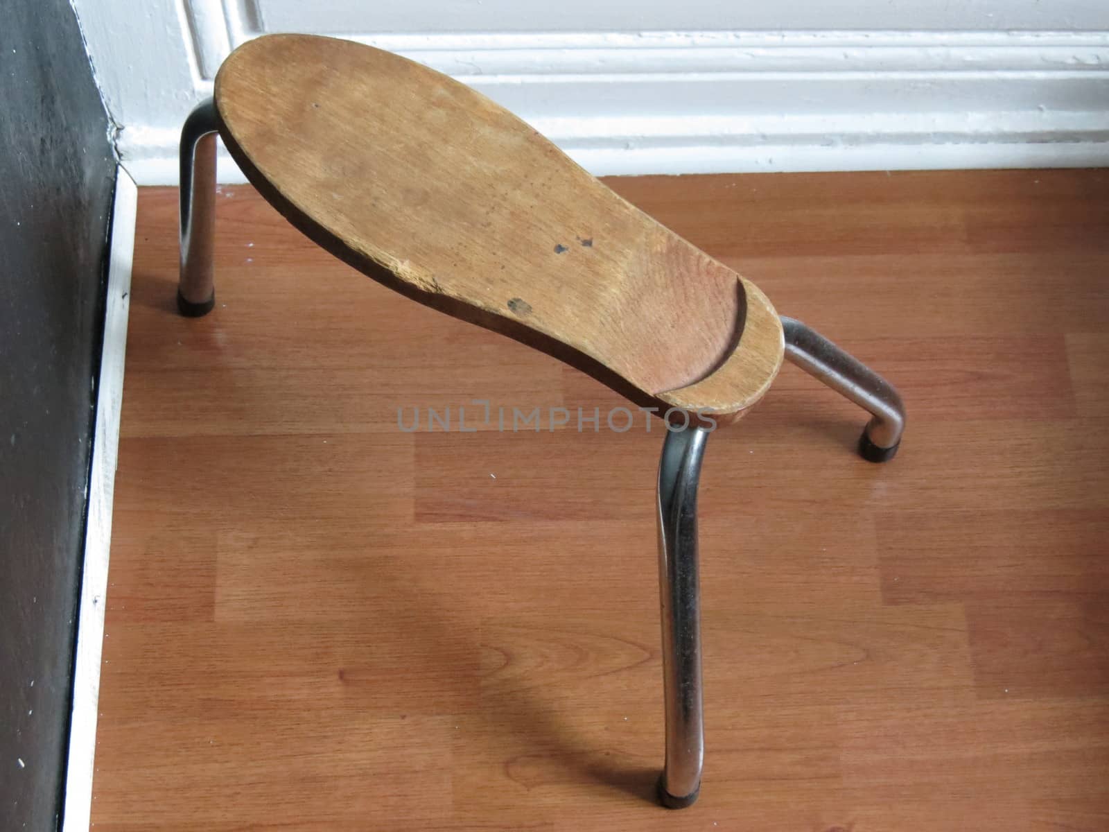 shoe stool made of wood with steel legs