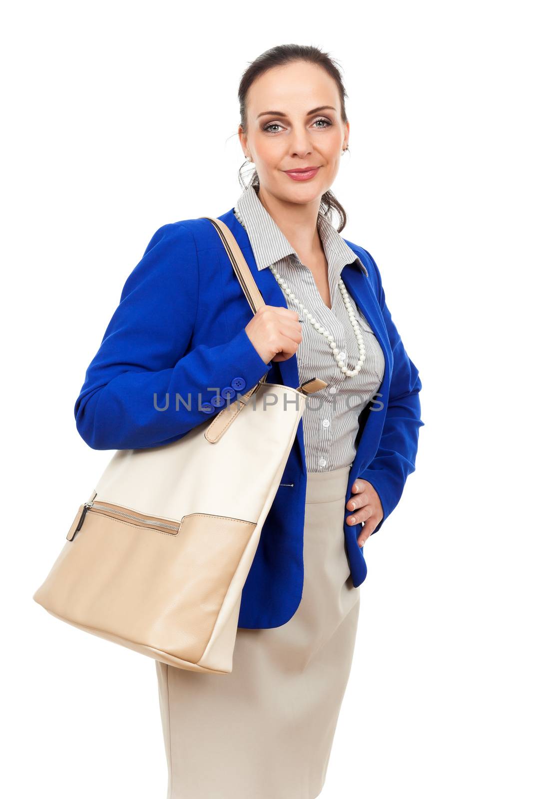An image of a business woman with a beige handbag