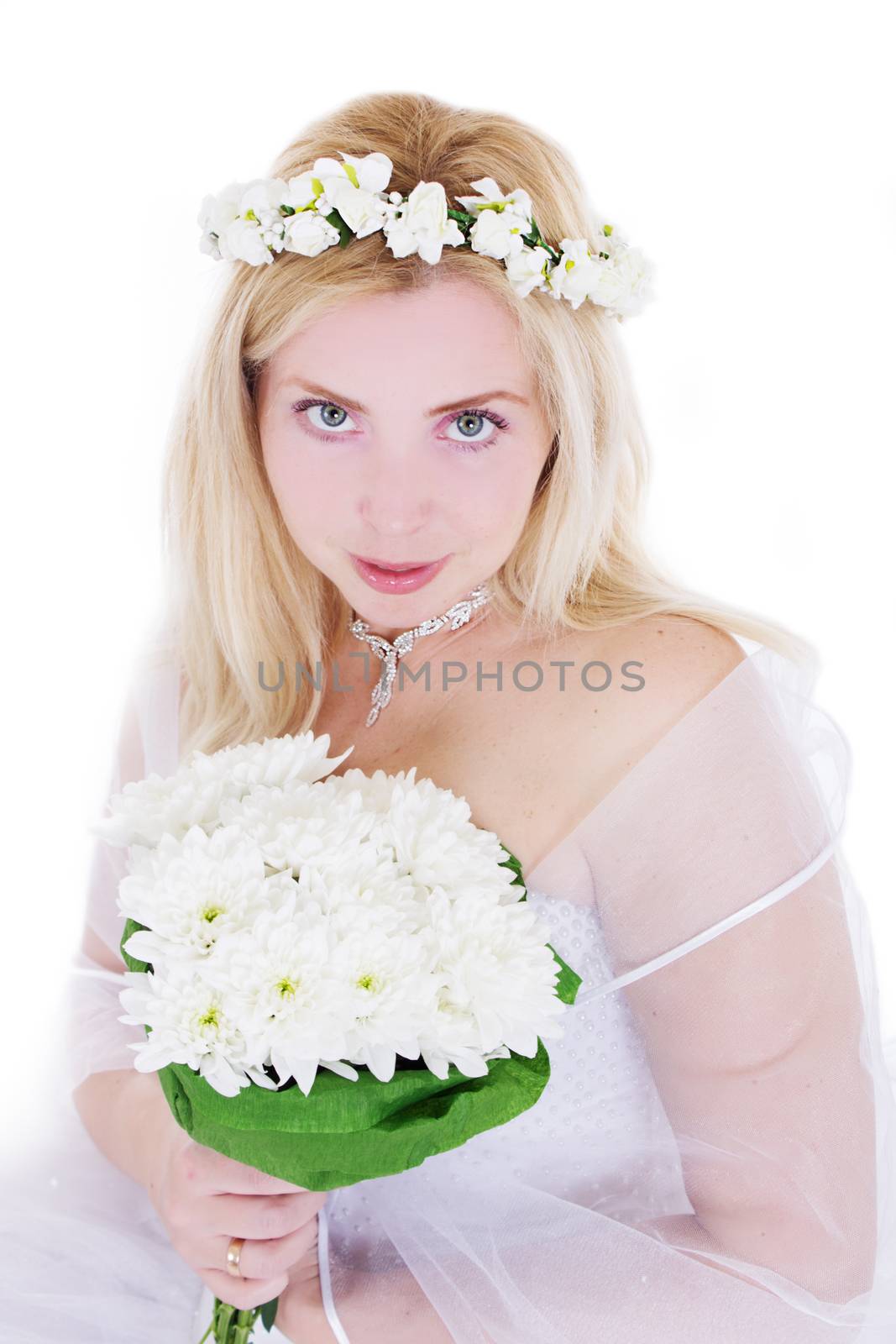 Sensual blonde bride in wreath and bouquet isolated on white