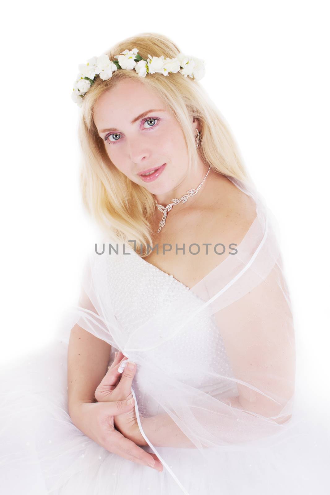 Sensual blonde bride in wreath isolated on white