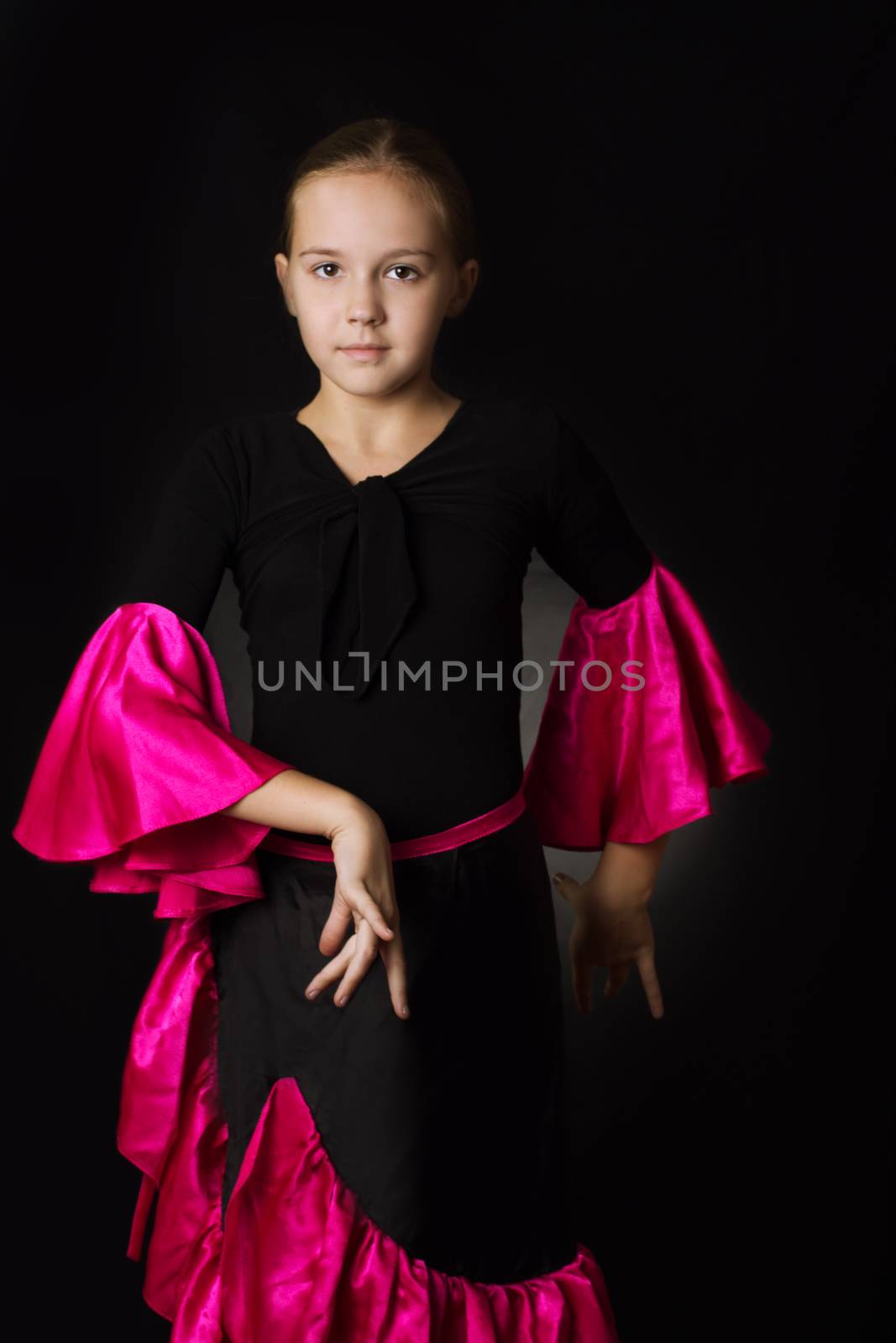 Flamenco little dancer posing isolated on black