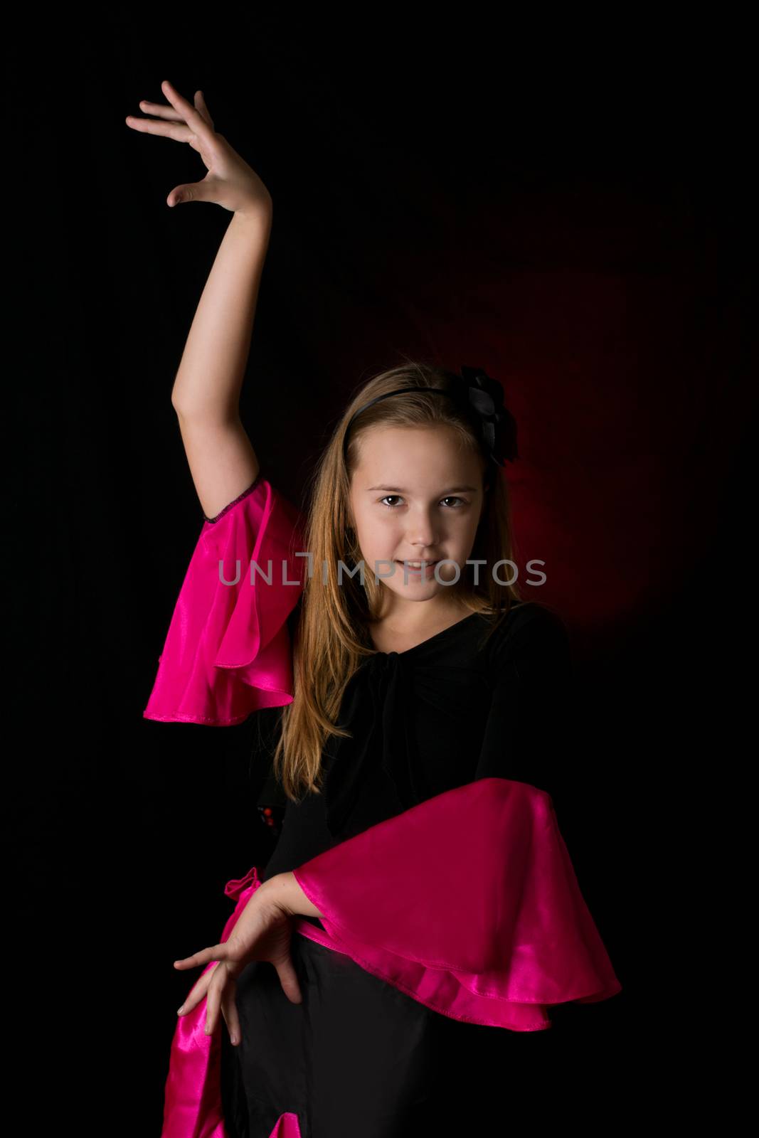 Flamenco little dancer posing isolated on black