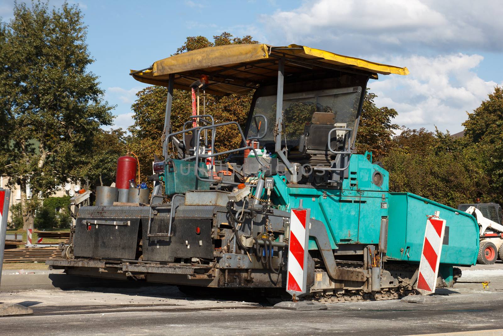 asphalt paving machine at construction sito on a street