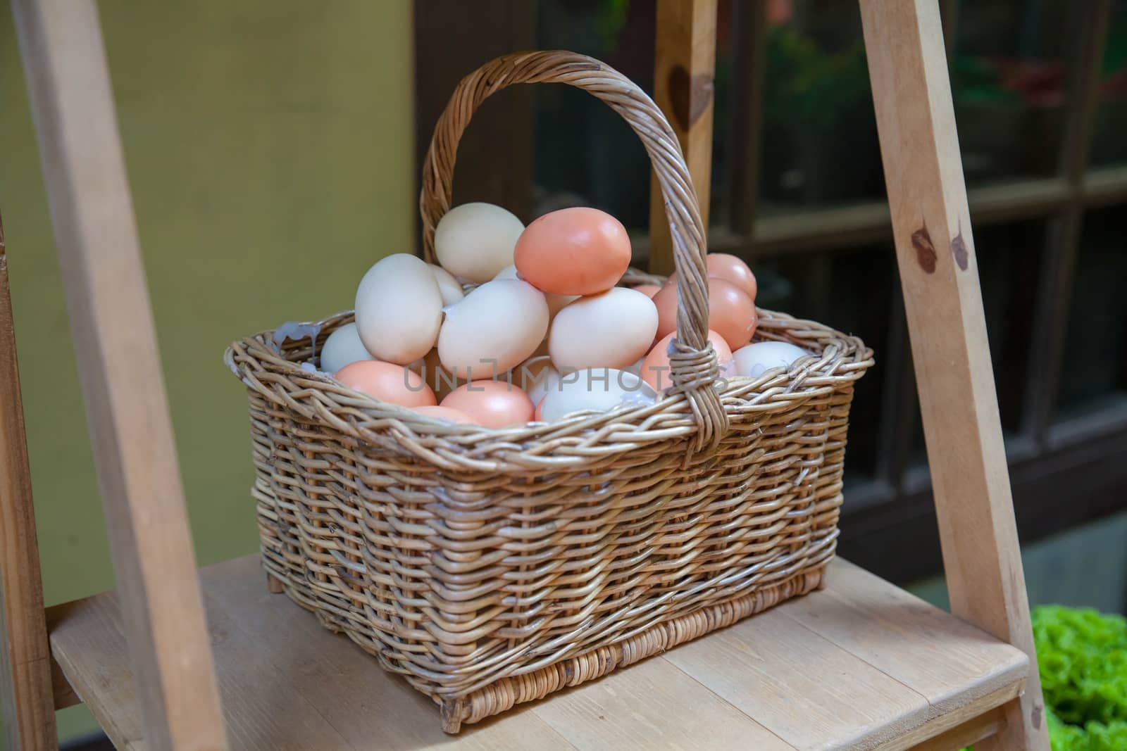 Brown eggs in the basket .