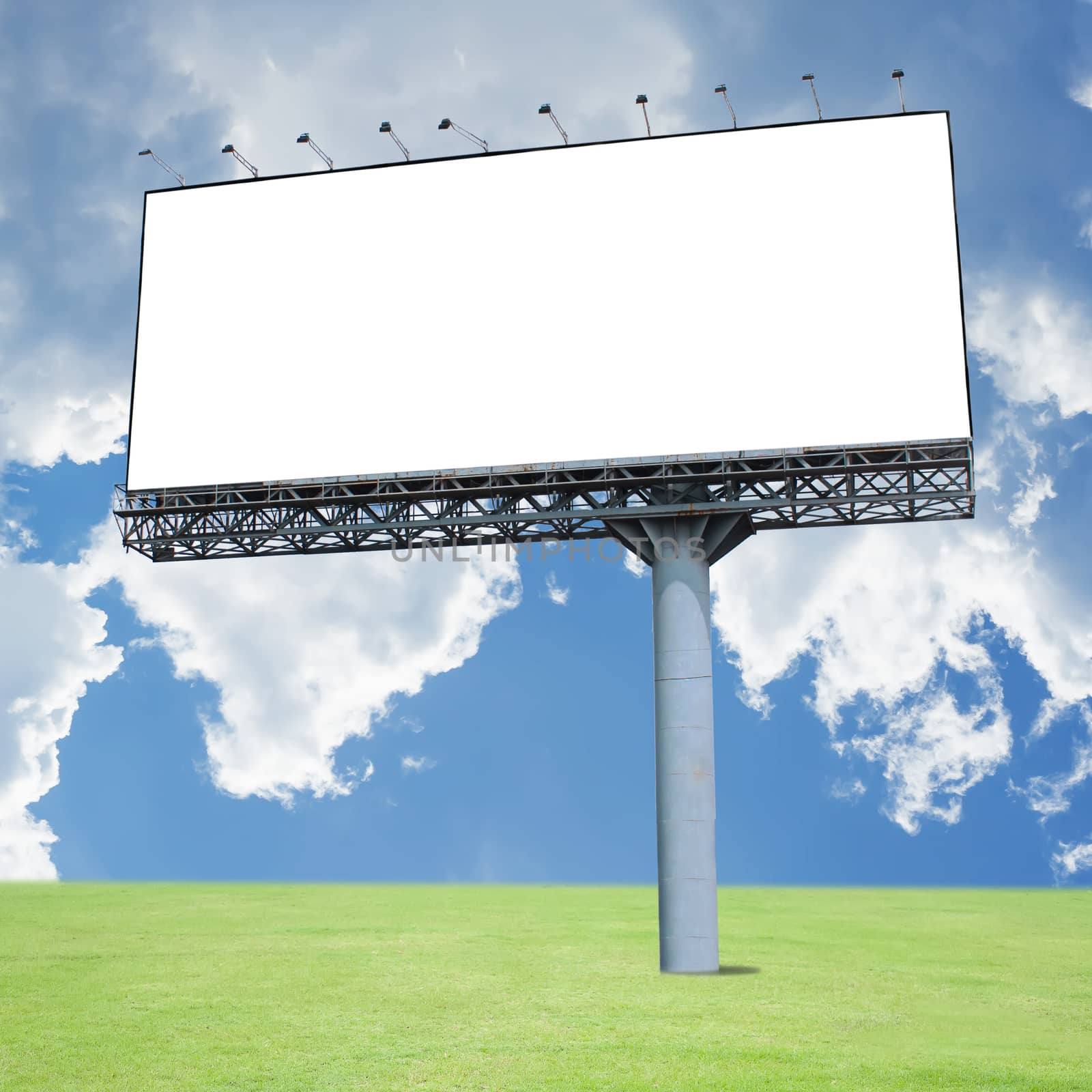 Blank billboard on the blue sky . Useful for your advertisement
