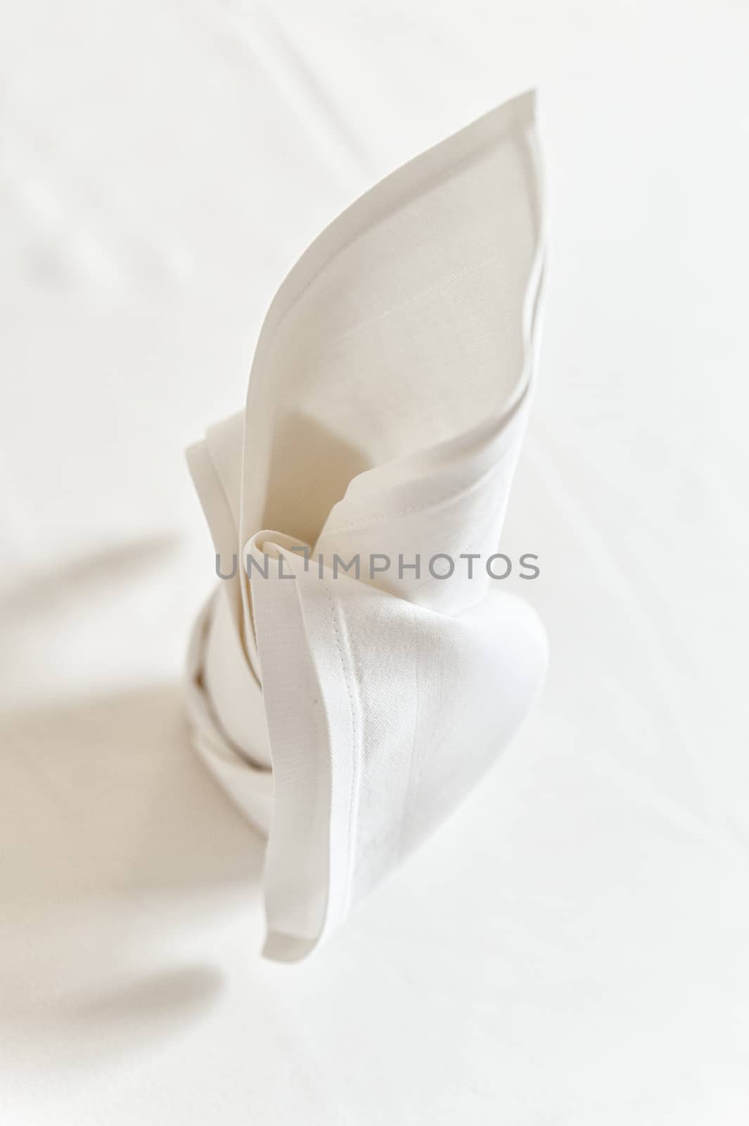Detail view of a folded white napkin