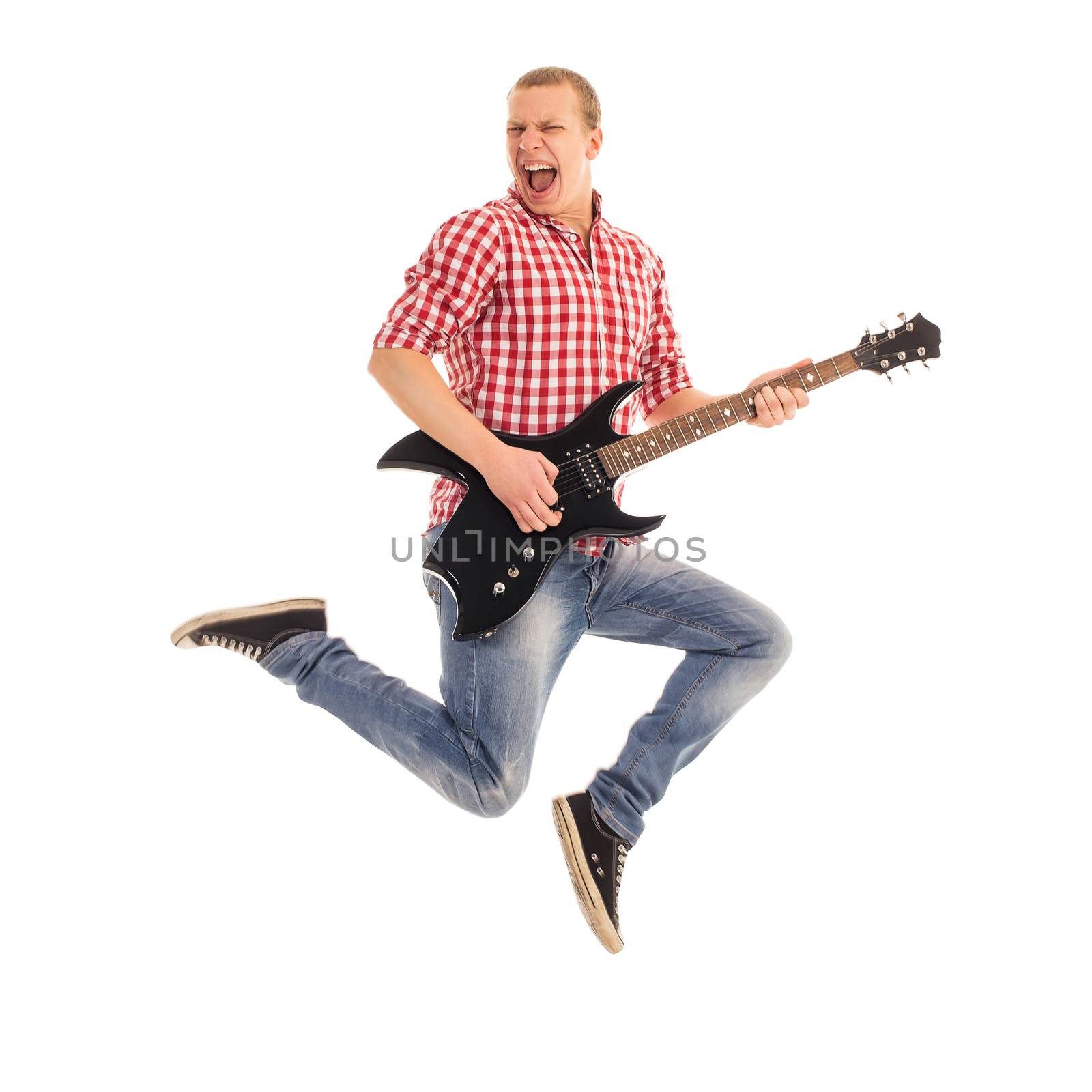 Young, crazy musician with electric guitar