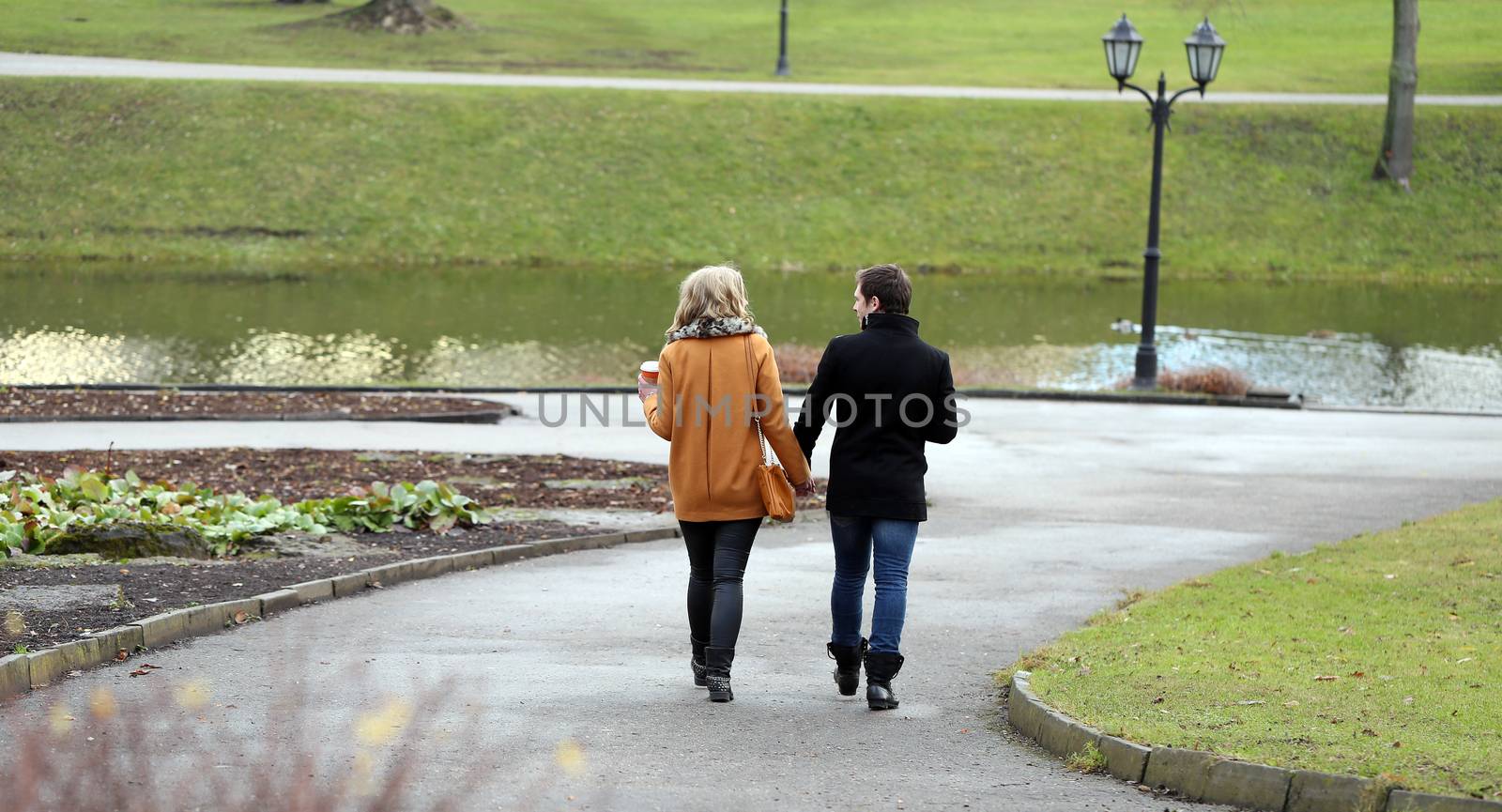 Autumn. Cute couple walk in the park