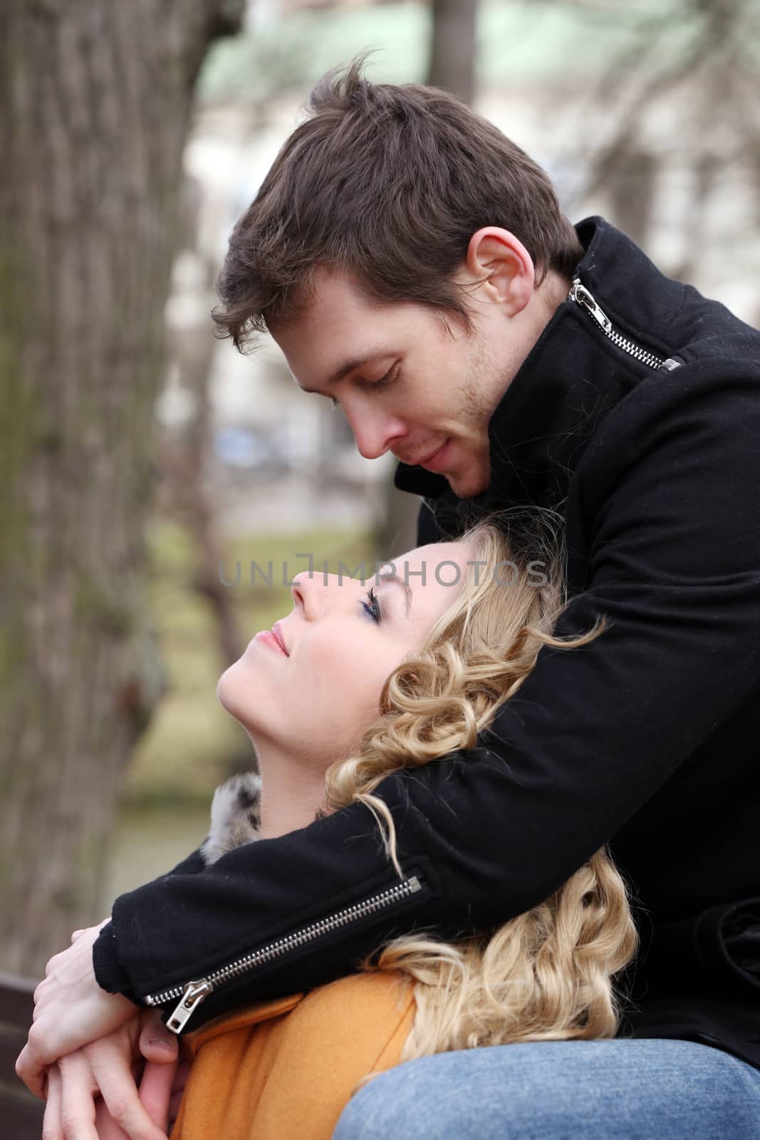 Autumn. Cute couple in the park