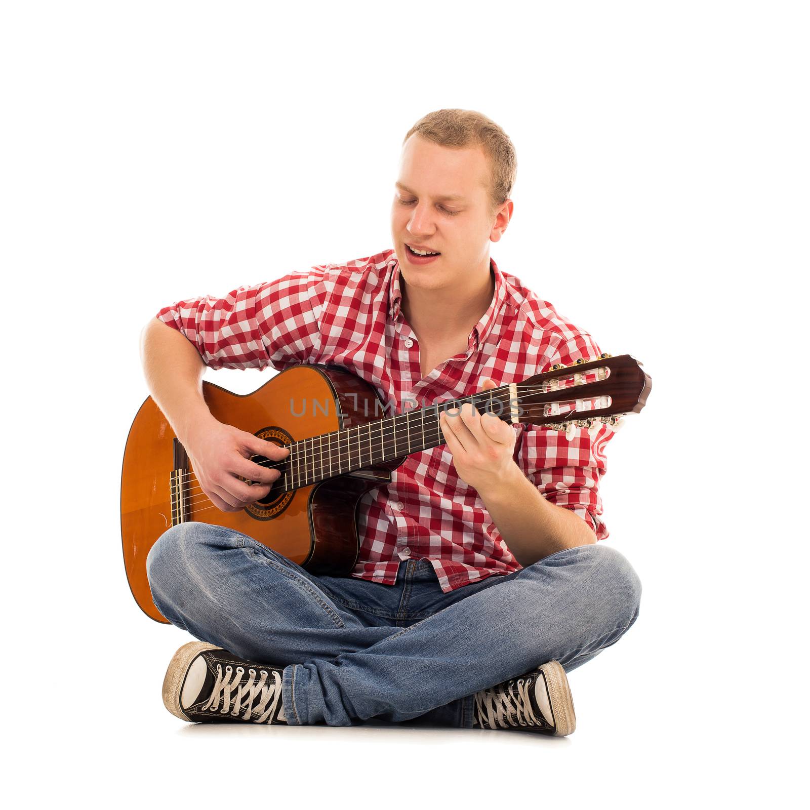 Young musician with wooden guitar