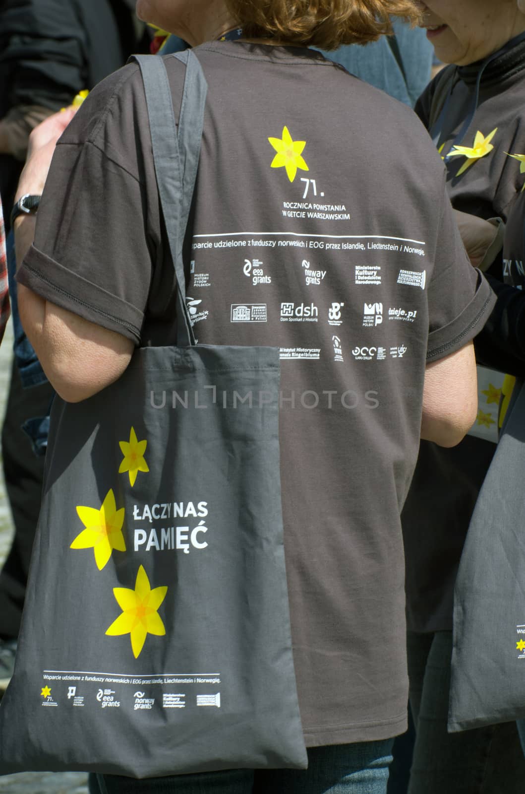 Warsaw, Poland – April 19, 2014: Celebration of the 71 anniversary of the Warsaw Ghetto Uprising. Volunteer.