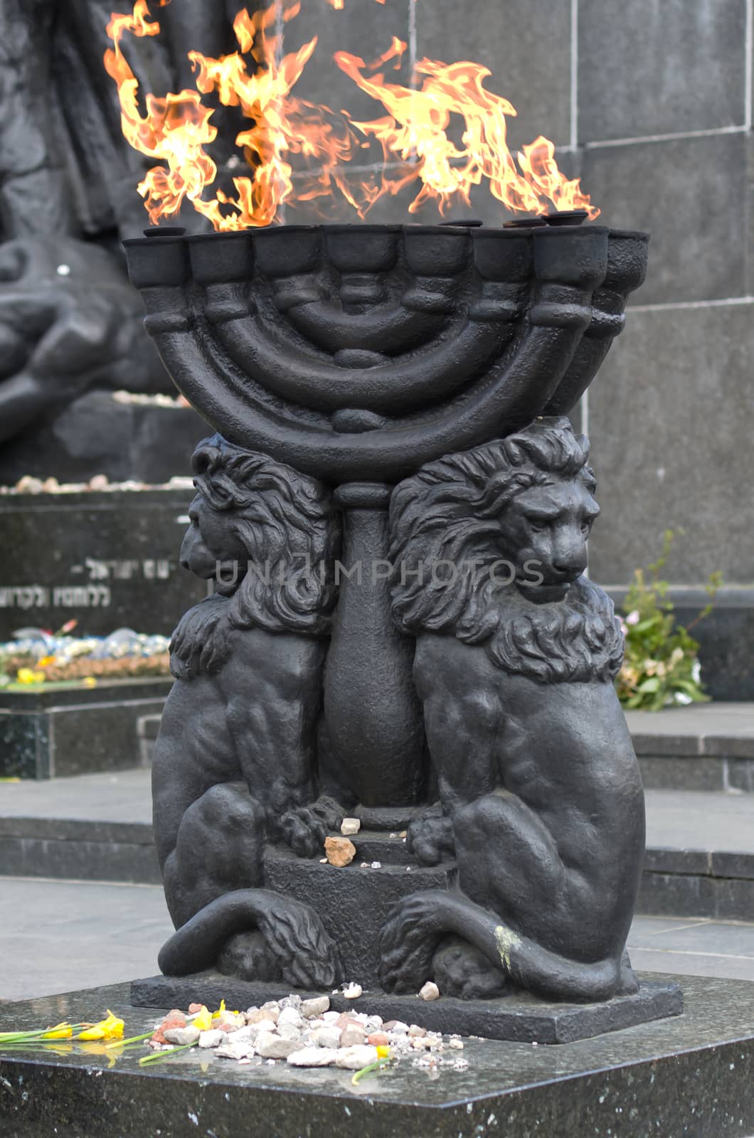 Warsaw, Poland – April 19, 2014: Celebration of the 71 anniversary of the Warsaw Ghetto Uprising. Menorah with burning flame.