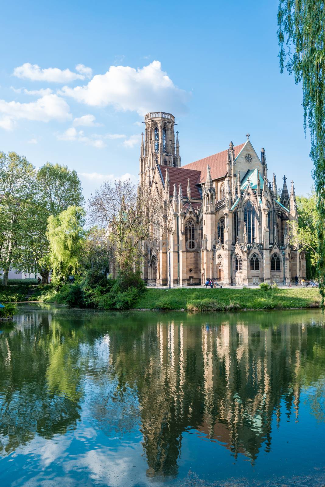 STUTTGART, GERMANY - APRIL 24, 2014: People are enjoying a great sunny spring day around Johanneskirche (St. Johns Church) at Feuersee (fire pond) on April, 26,2014 in Stuttgart, Germany.