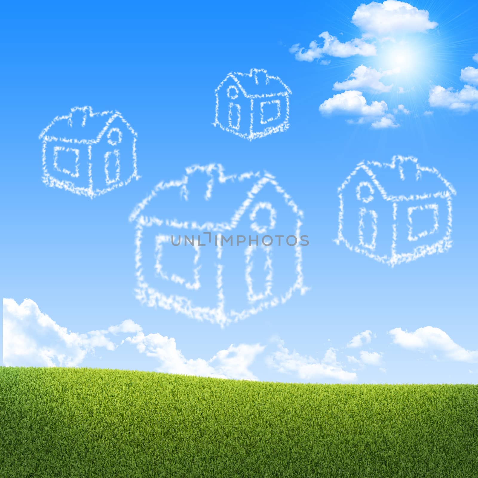 Houses of clouds in the sky over green grass. Dreams concept