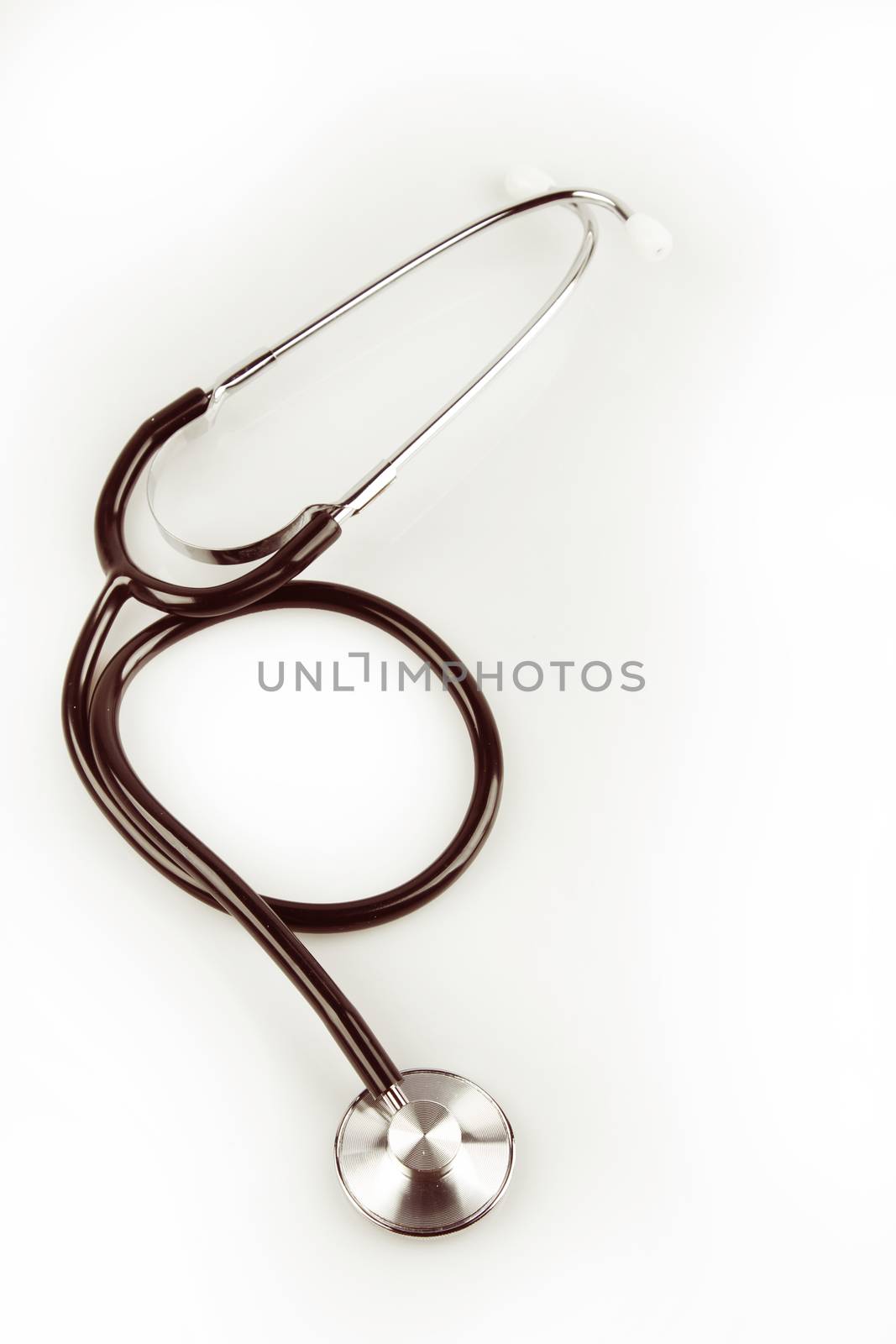 Stethoscope on plain background
