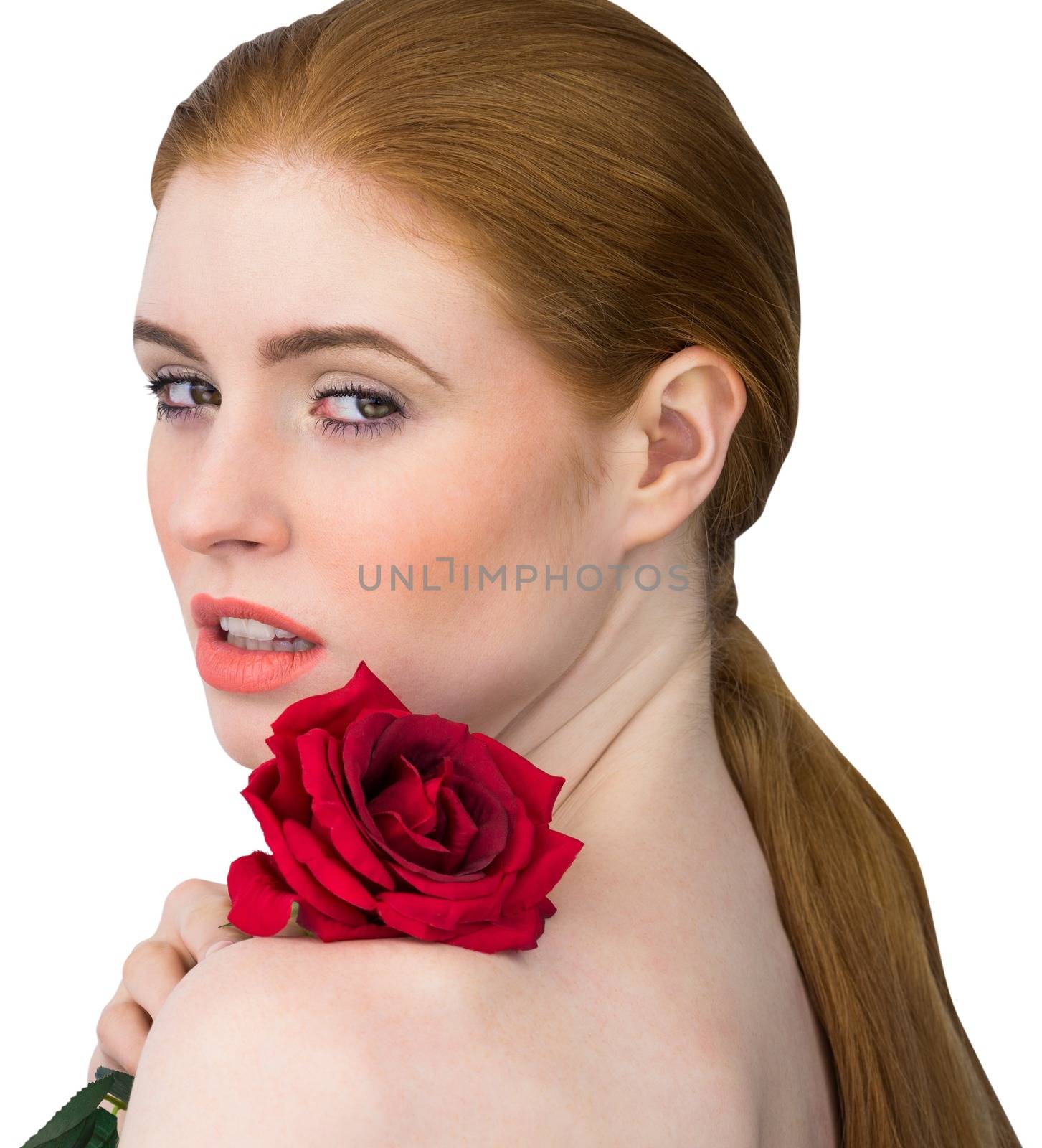 Beautiful redhead posing with red rose on white background