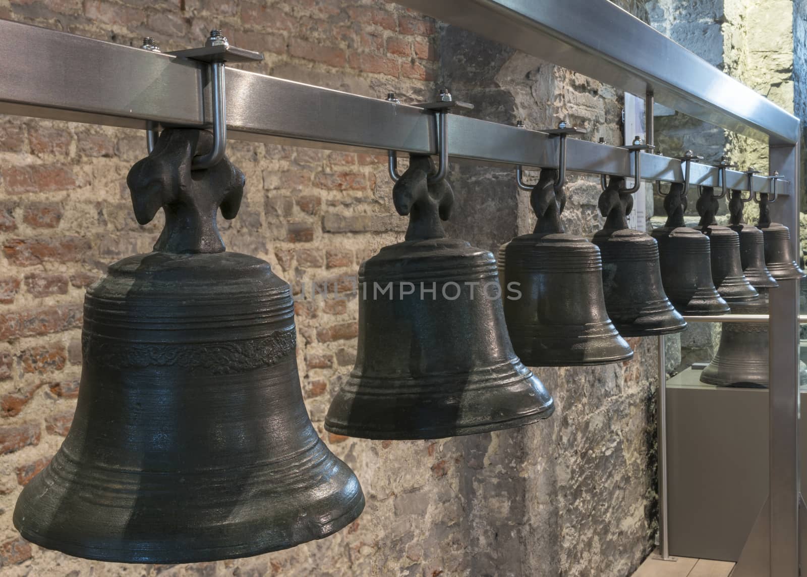 Collection of bells hangs in Ghent Belfry, Belgium. by Claudine