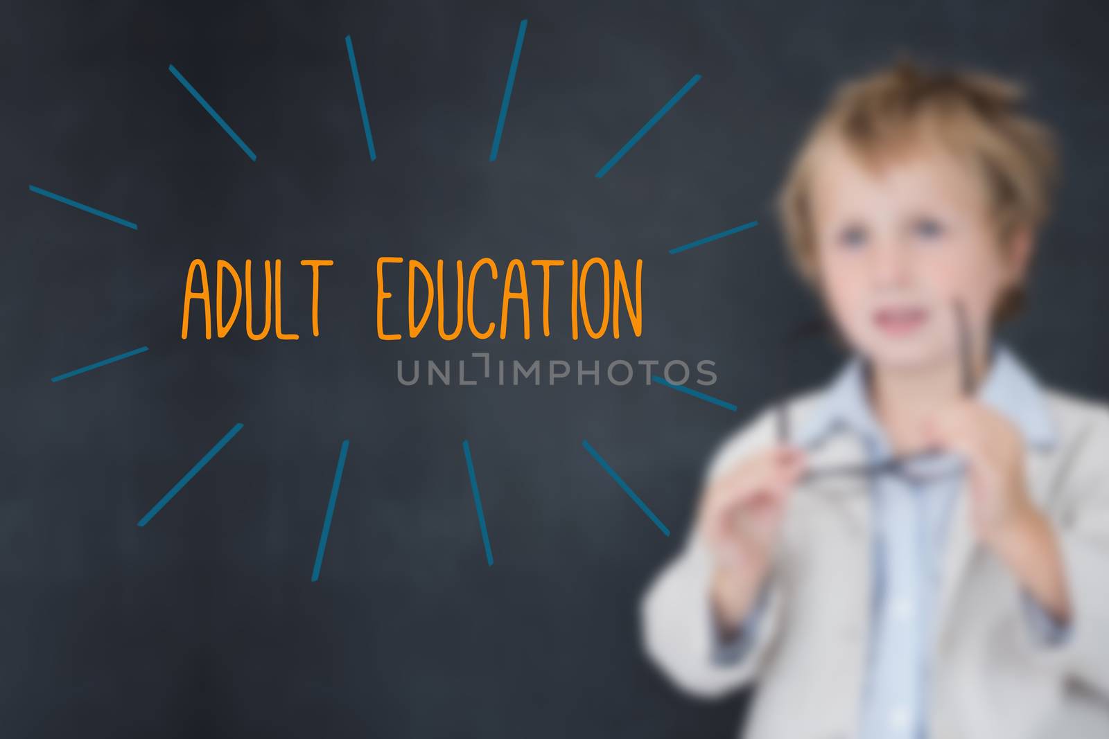 The word adult education against schoolboy and blackboard