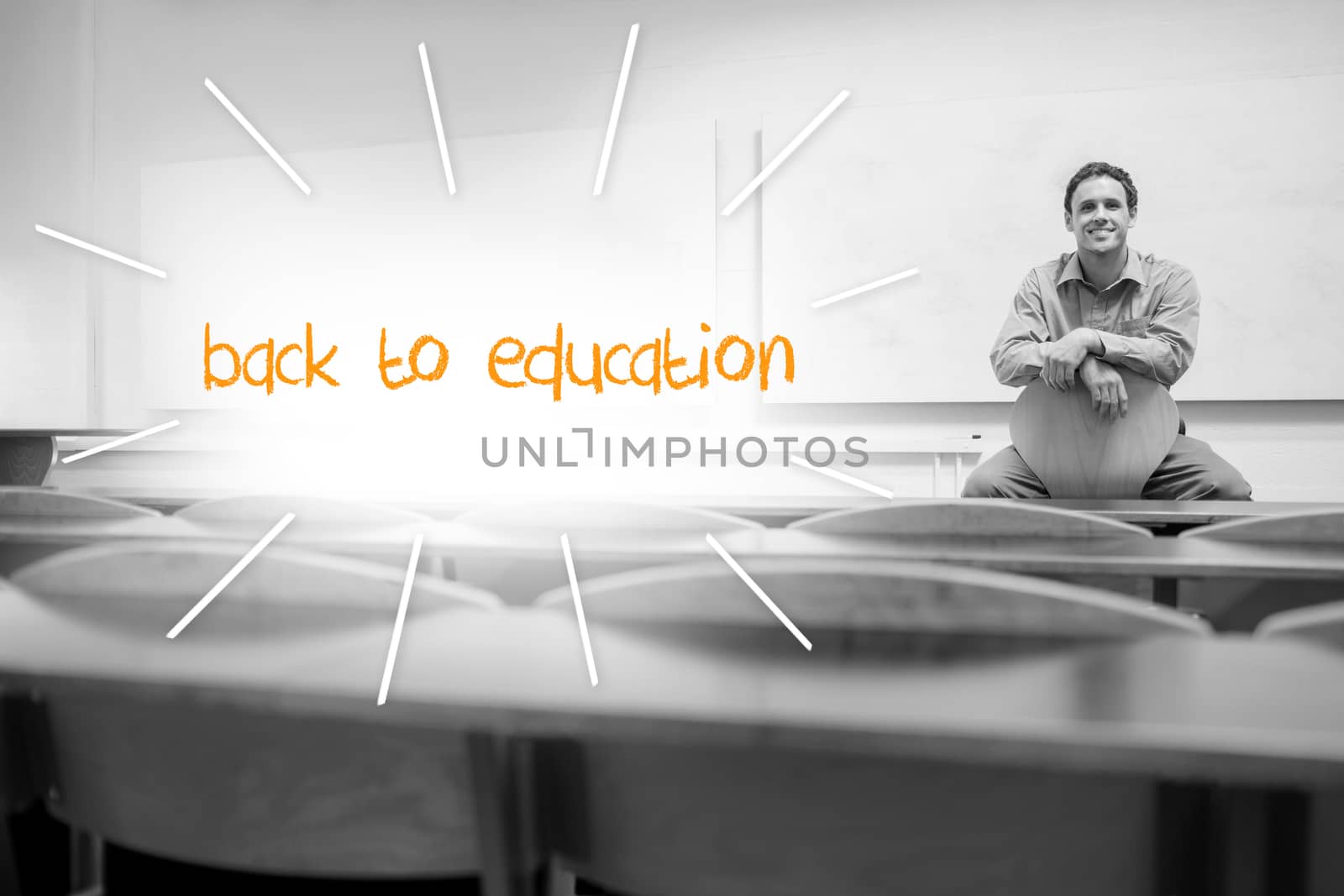 Back to education against lecturer sitting in lecture hall by Wavebreakmedia