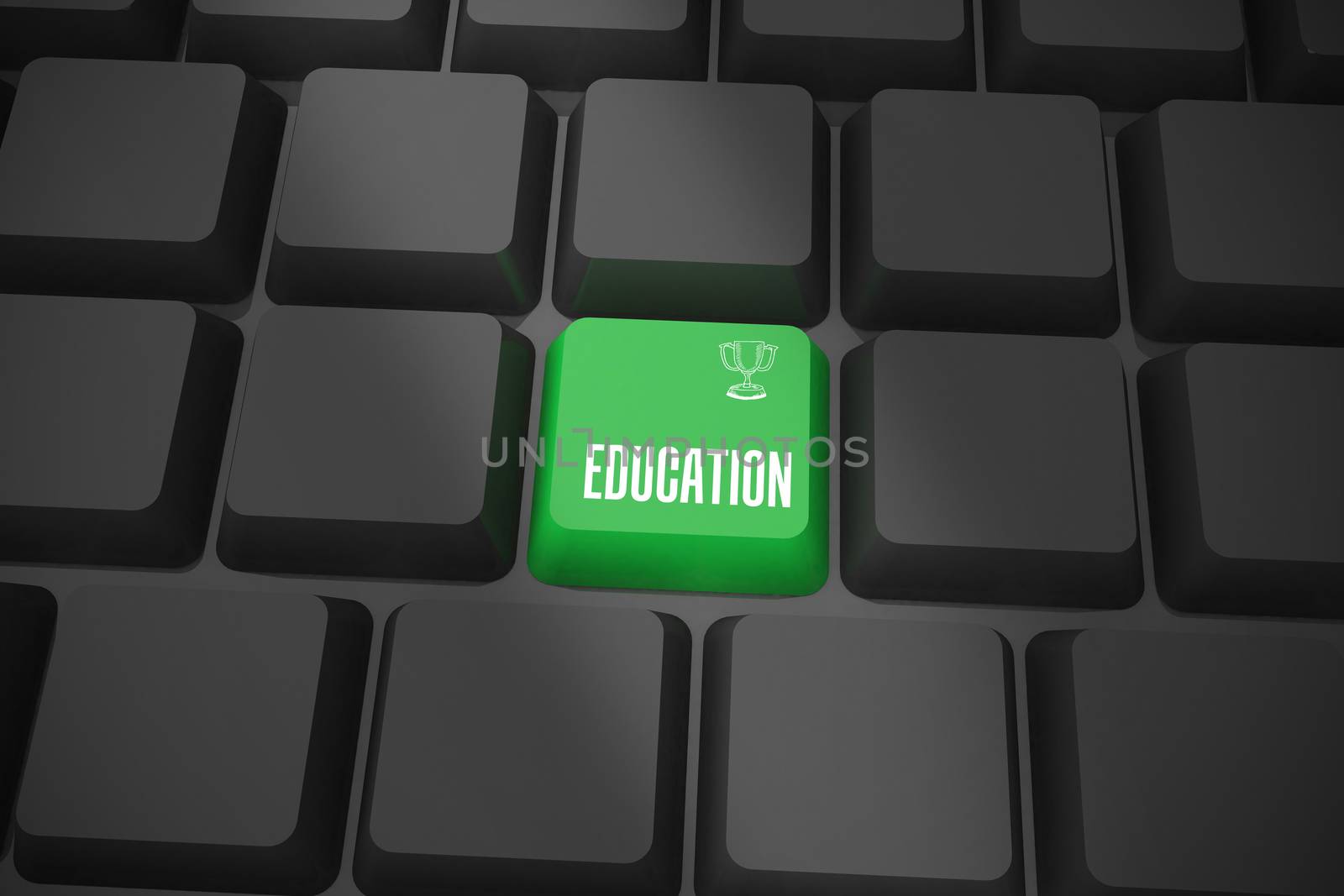 The word education and winners cup on black keyboard with green key