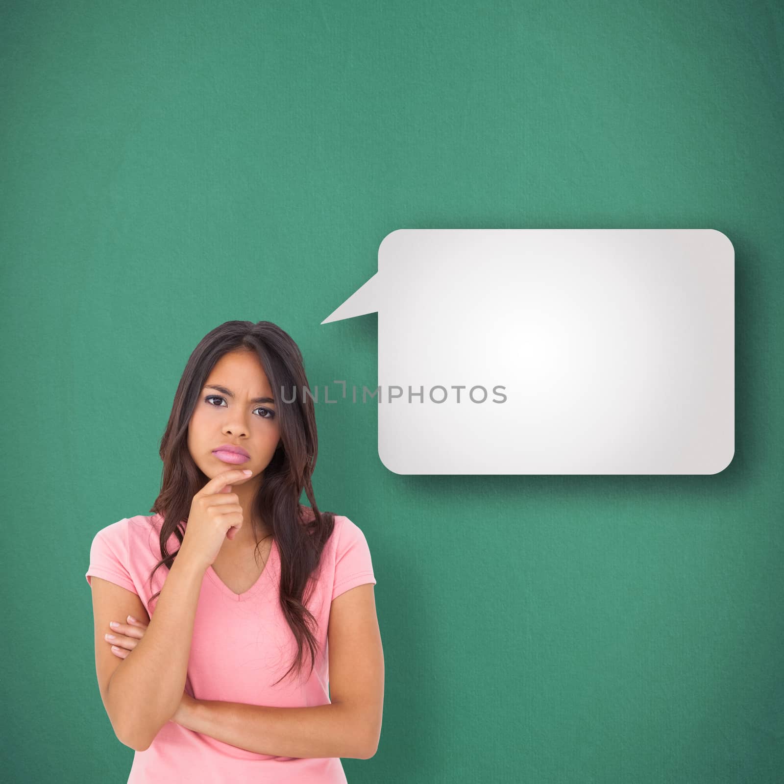 Composite image of pretty brunette thinking by Wavebreakmedia