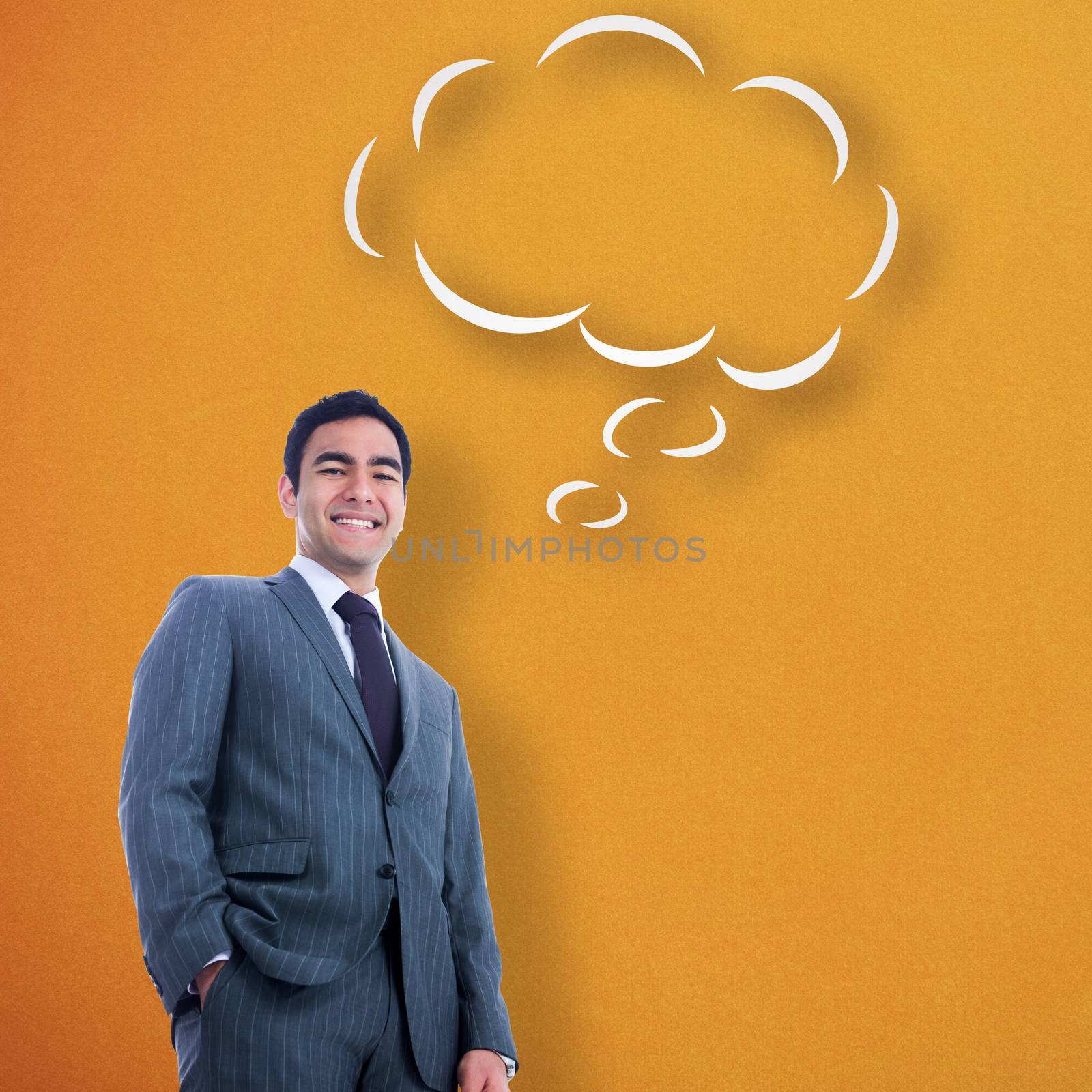 Smiling businessman standing against thought bubble